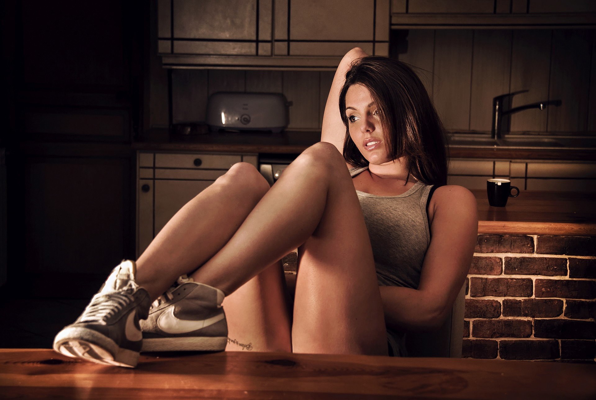 People 1920x1288 women model Laurent Kace sneakers brunette sitting tank top looking into the distance women indoors indoors legs together cup toaster shoes dark hair thighs