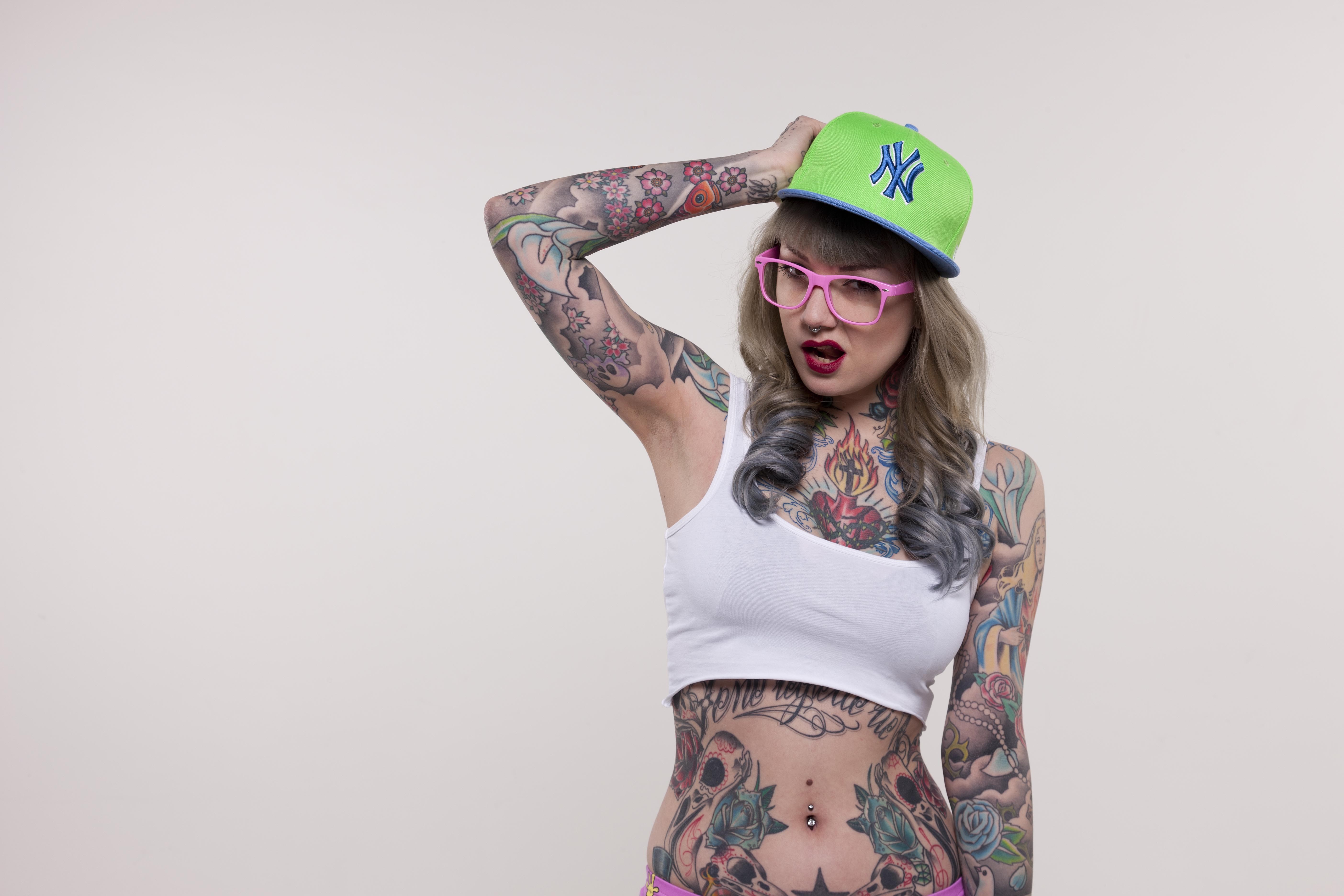 People 5616x3744 Nina Kate tattoo women crop top pierced navel pierced septum women with glasses arms up studio inked girls simple background white background belly looking at viewer hat women with hats open mouth armpits standing Suicide Girls pornstar