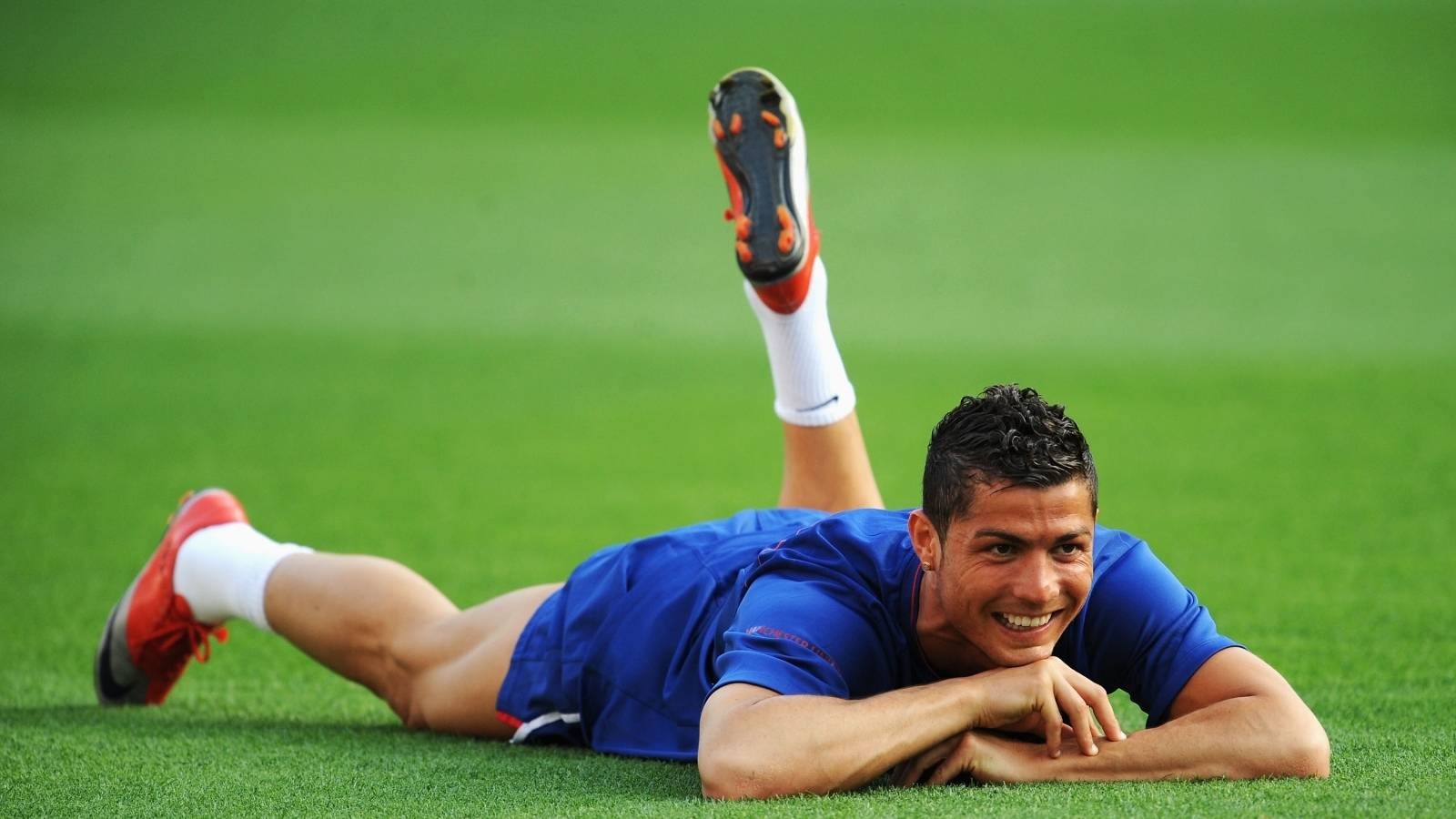 People 1600x900 footballers Cristiano Ronaldo men soccer sport legs legs up dark hair grass