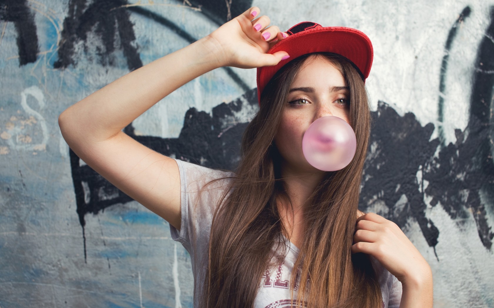 People 1680x1050 hazel eyes bubble gum brunette long hair looking into the distance T-shirt food sweets hat women with hats looking away pink nails painted nails women