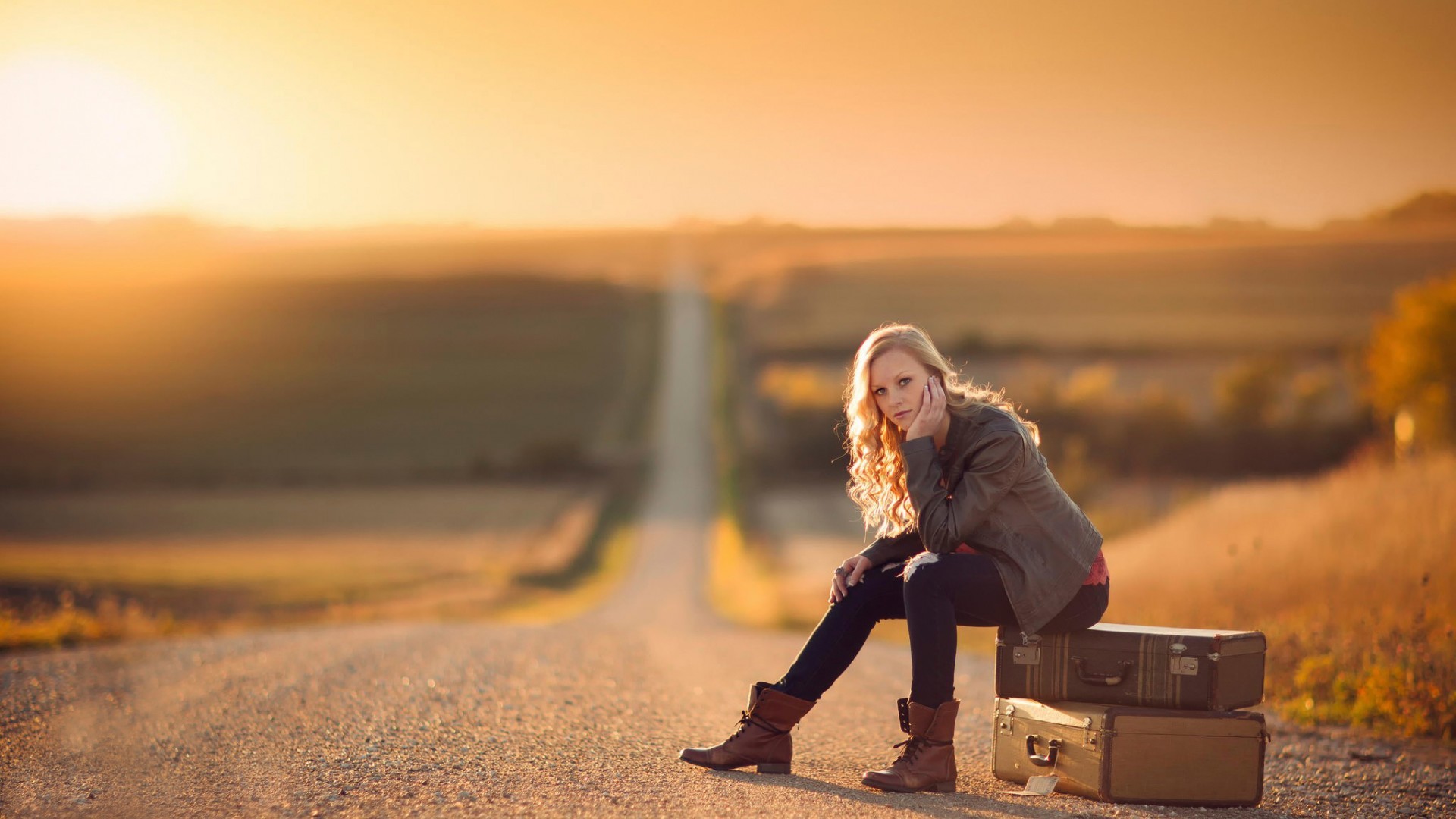 People 1920x1080 women blonde women outdoors road sunset suitcase sitting Jake Olson curly hair jacket outdoors looking at viewer long road model