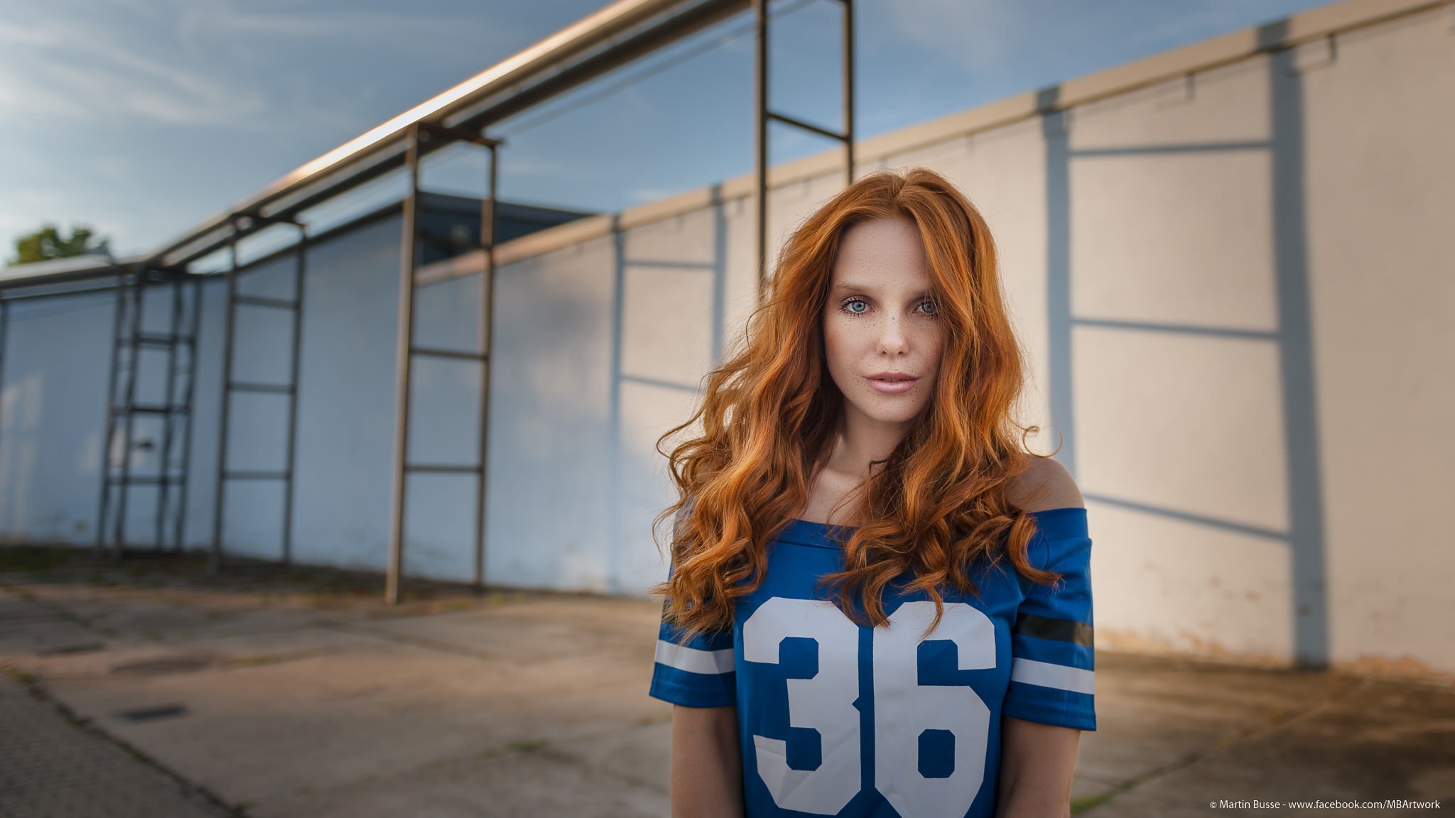 People 2048x1152 women face portrait redhead sports jerseys looking at viewer long hair numbers blue shirt blue clothing women outdoors outdoors dyed hair urban Martin Busse pink lipstick freckles