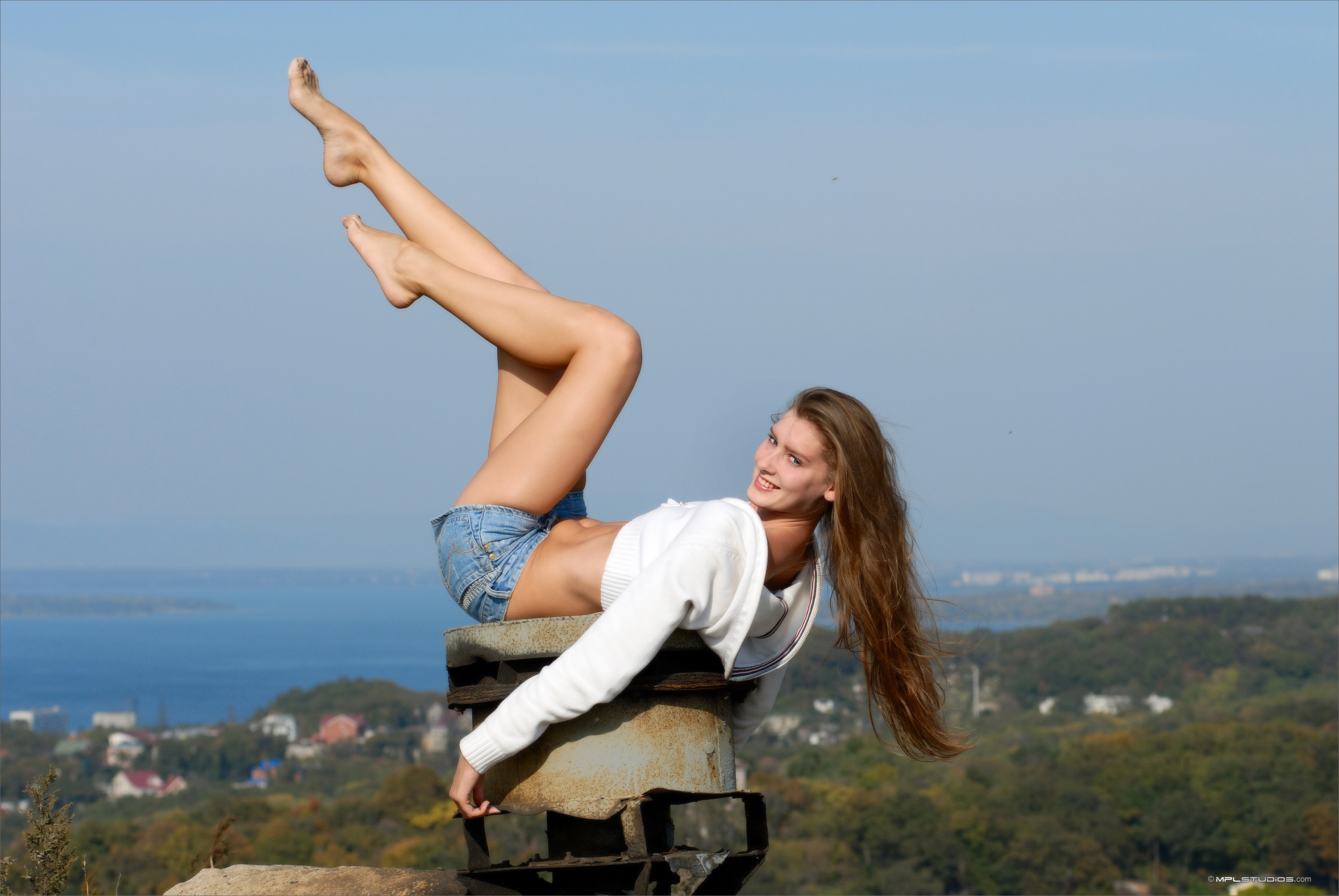 People 3000x2008 MPL Studios women model women outdoors brunette long hair chimneys lying on back smiling looking at viewer white tops bare midriff jean shorts legs barefoot feet in the air pointed toes