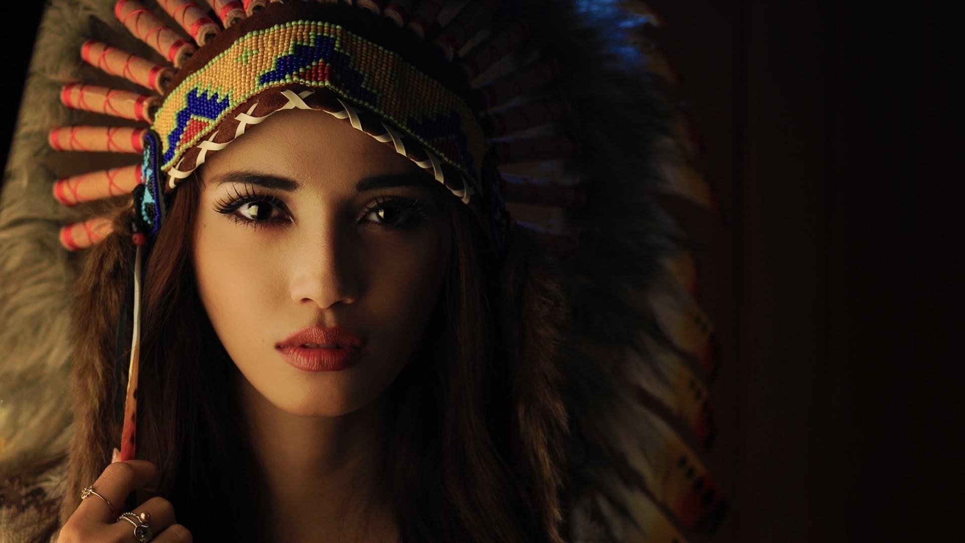 People 1920x1080 feathers women Native American clothing sacrilege headdress model face looking at viewer closeup low light