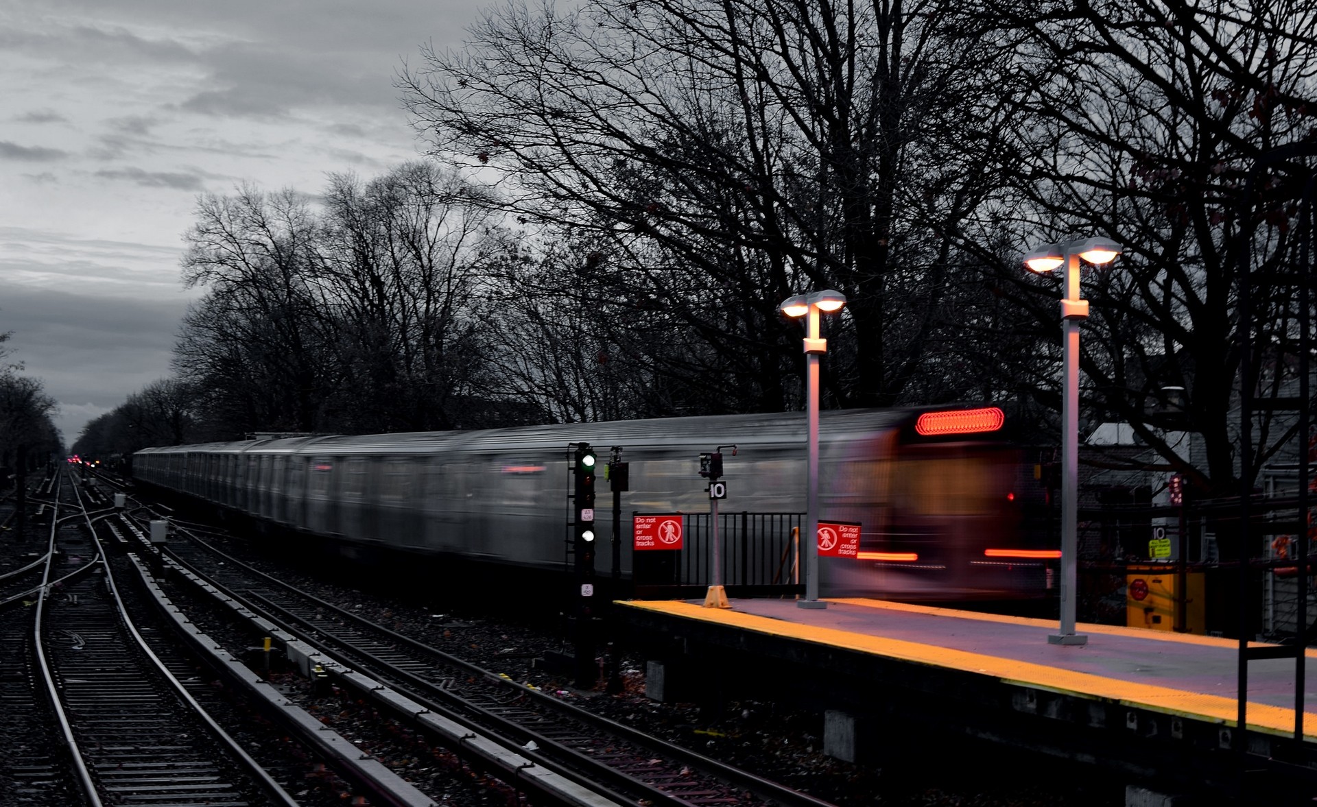General 1920x1177 train light trails selective coloring motion blur railway gray outdoors