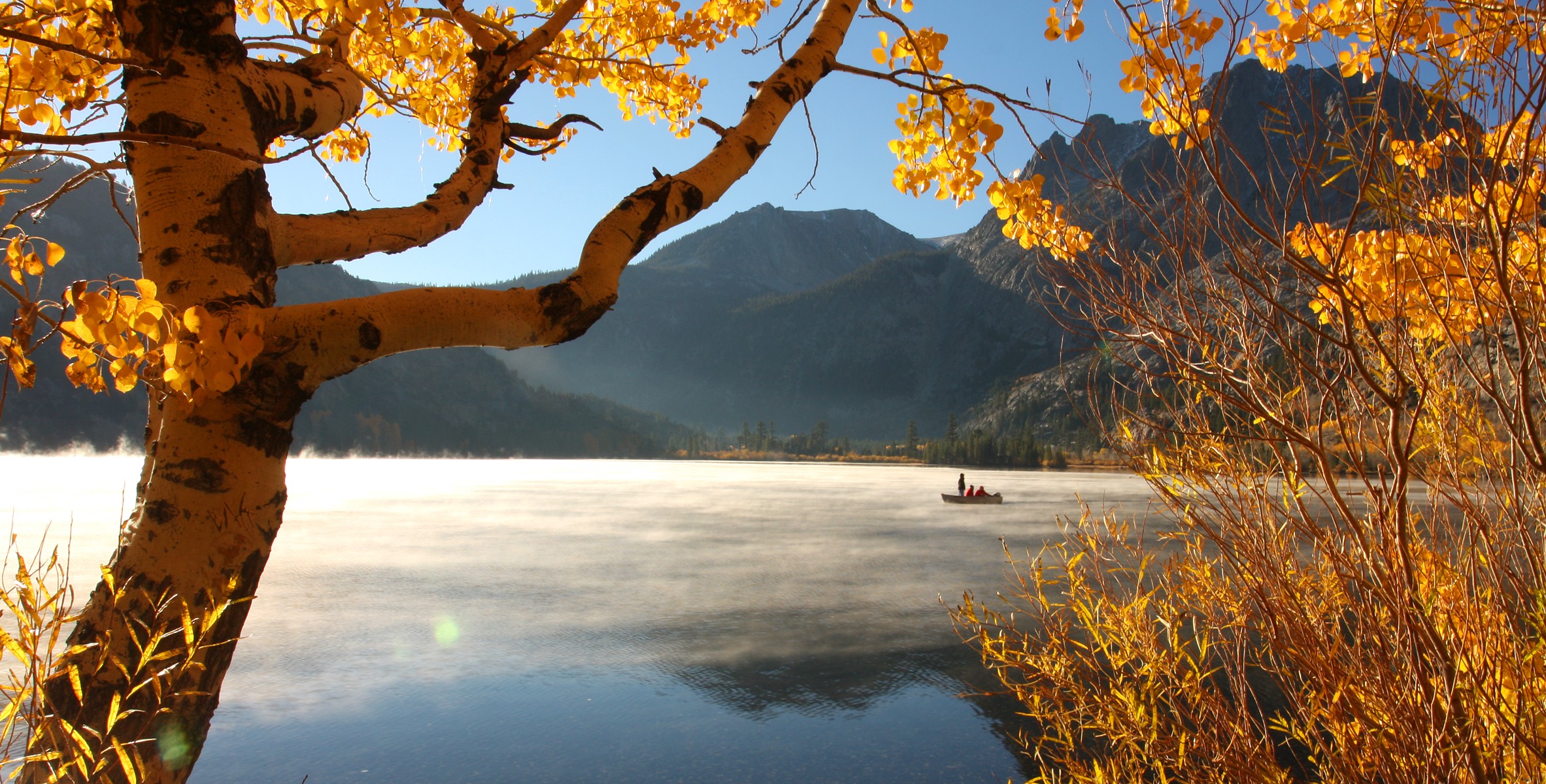 General 2365x1200 fall lake mountains nature forest trees landscape daylight birch yellow boat