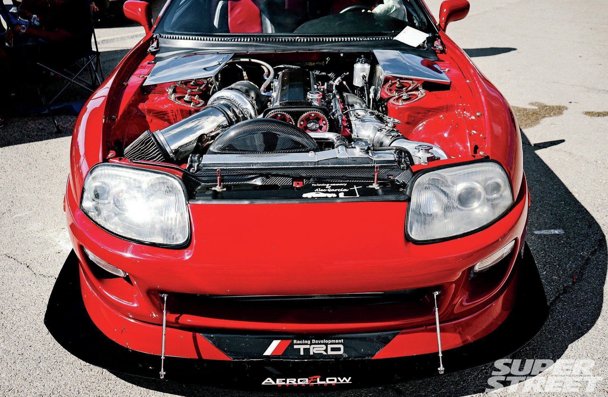 General 2048x1340 Toyota Supra 2JZ-GTE Toyota engine technology vehicle red cars Japanese cars frontal view sunlight headlights car