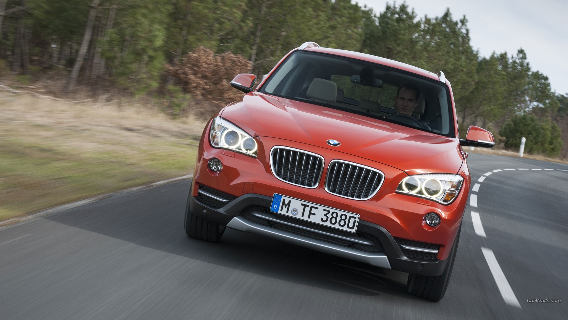 General 1920x1080 BMW X1 car frontal view BMW vehicle red cars road men German cars SUV