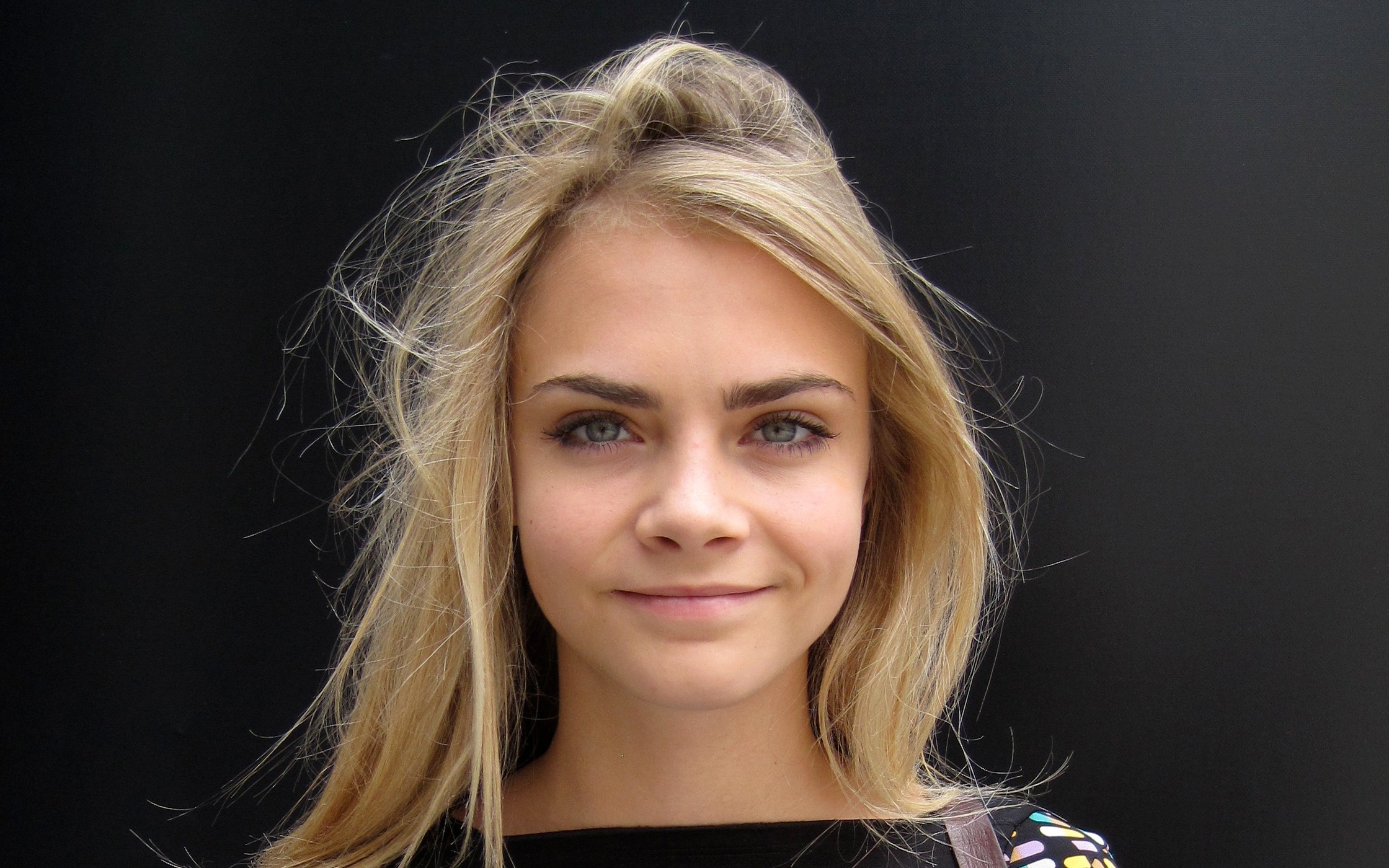 People 2240x1400 Cara Delevingne model face smiling looking at viewer blonde simple background black background women actress British British women cropped