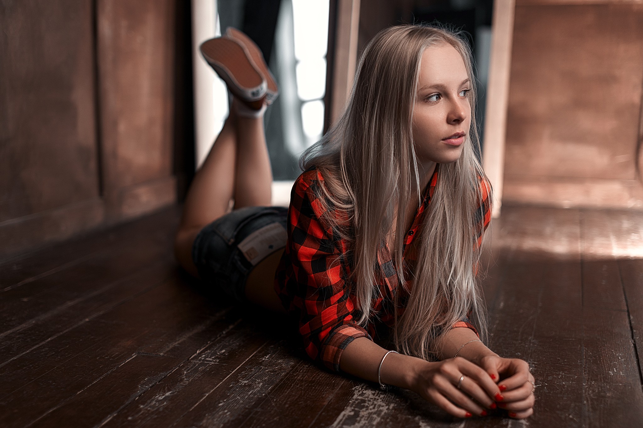 People 2048x1365 women blonde jean shorts on the floor wooden surface looking away legs up Stepan Gladkov women indoors indoors plaid shirt plaid clothing long hair red nails painted nails lying on front model