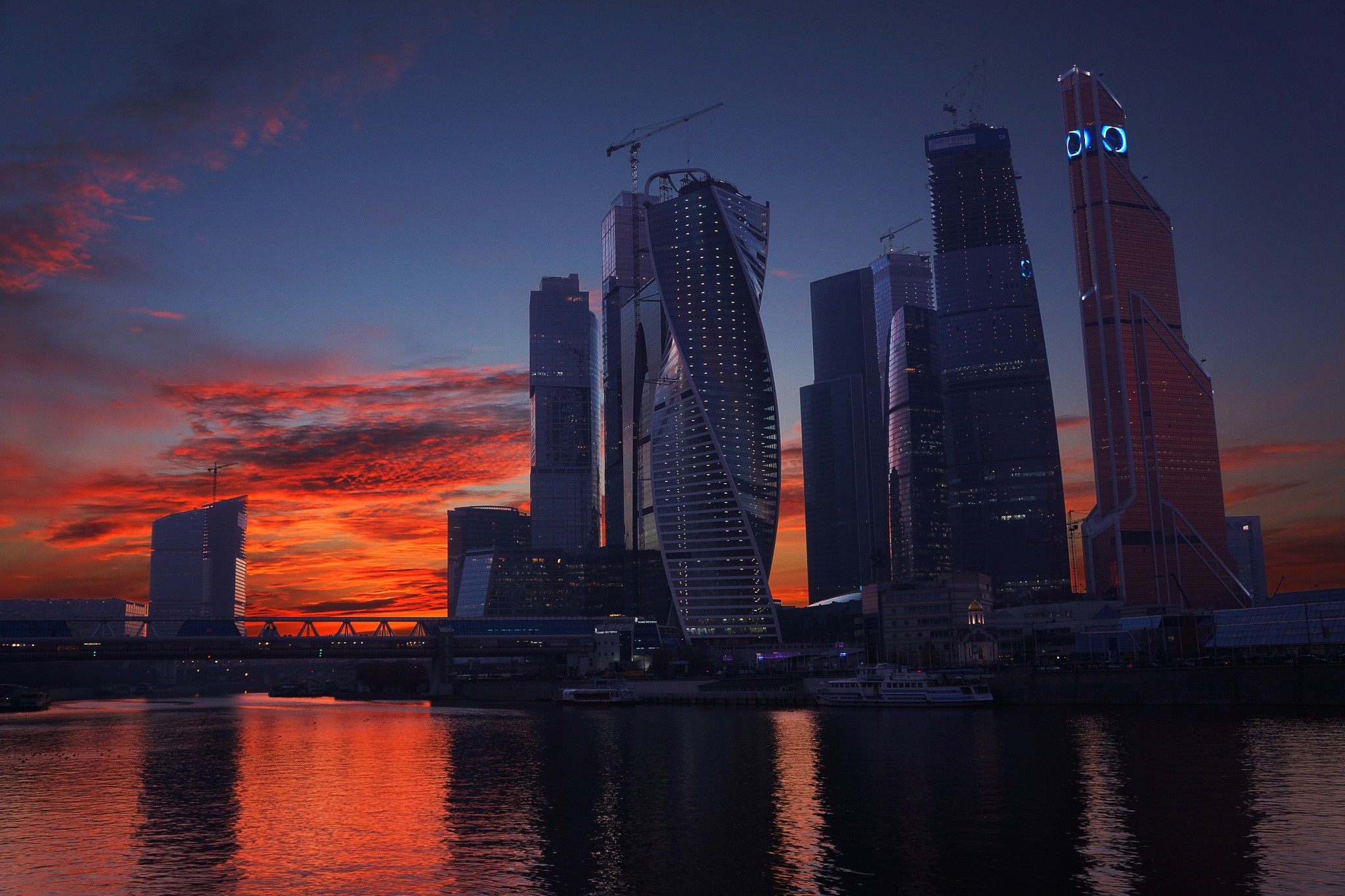 General 2048x1365 city Moscow skyscraper orange sky dusk cranes (machine) sunset Russia cityscape sky