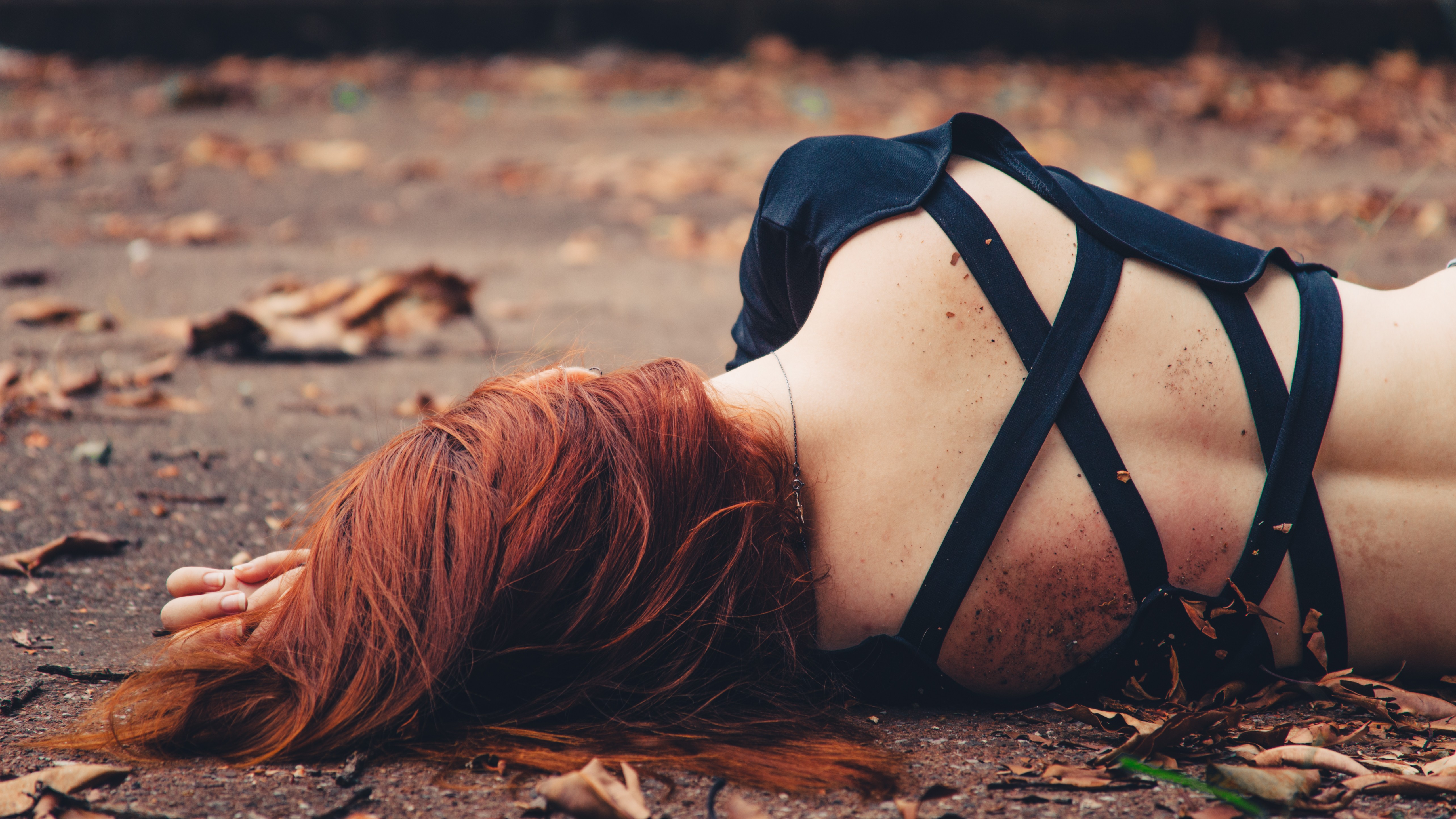 People 5132x2887 women model redhead long hair lying down ground leaves fall rear view dirty black outfits necklace on the ground lying on side depth of field outdoors women outdoors