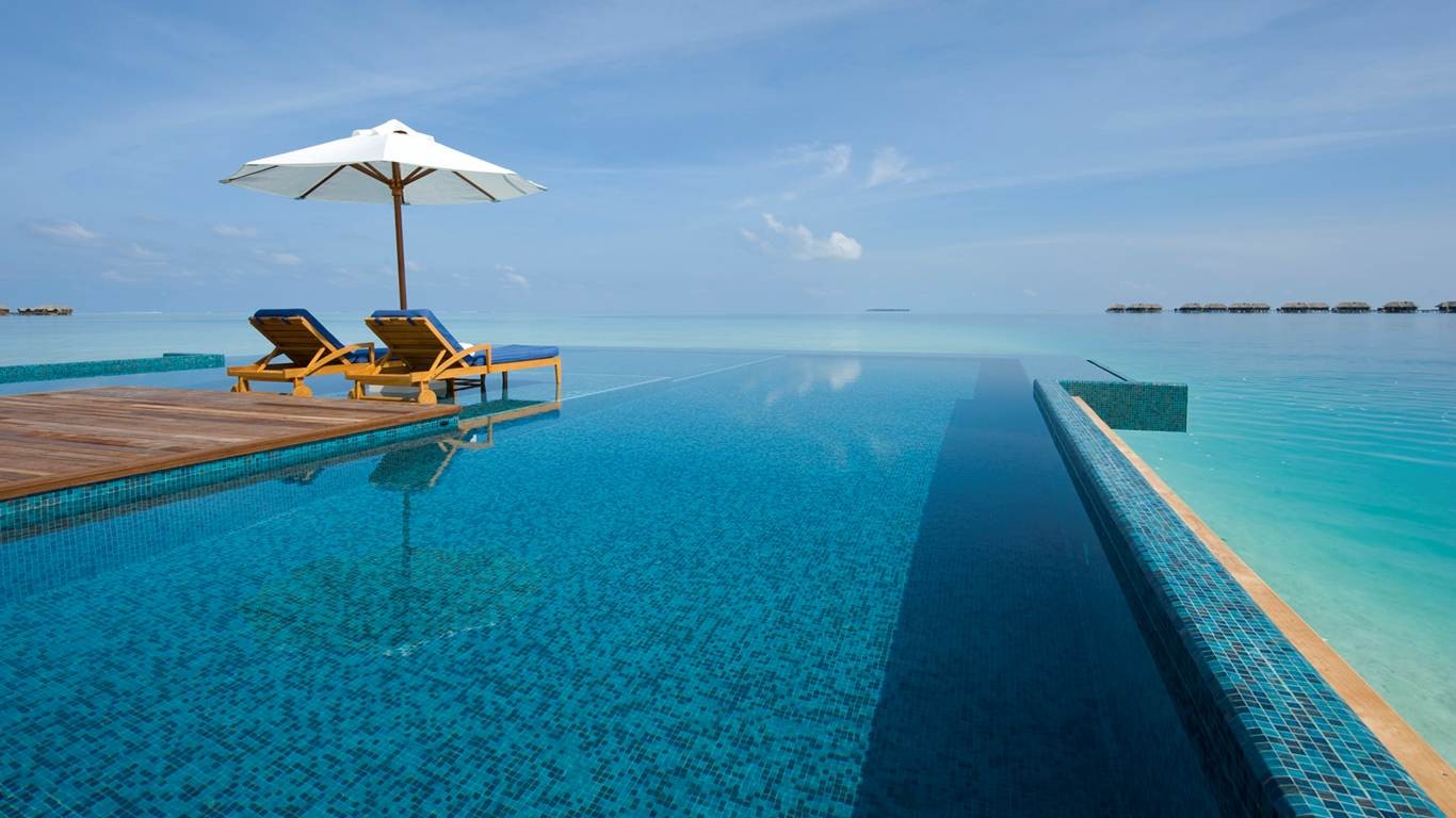 General 1366x768 swimming pool vacation summer tropical sea resort water Maldives deck chairs
