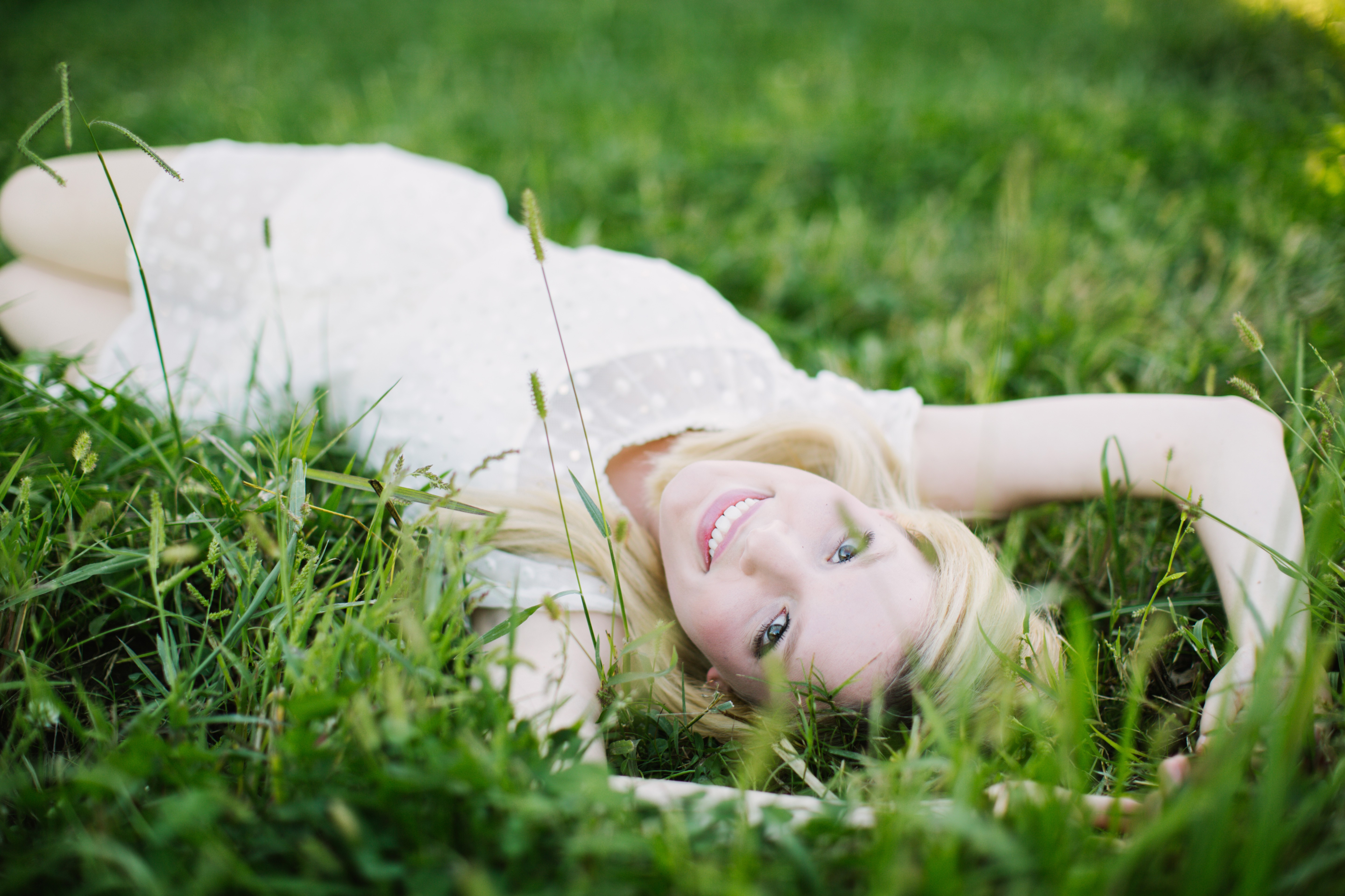 People 5760x3840 women blonde women outdoors lying down white dress smiling looking at viewer lying on front grass dress