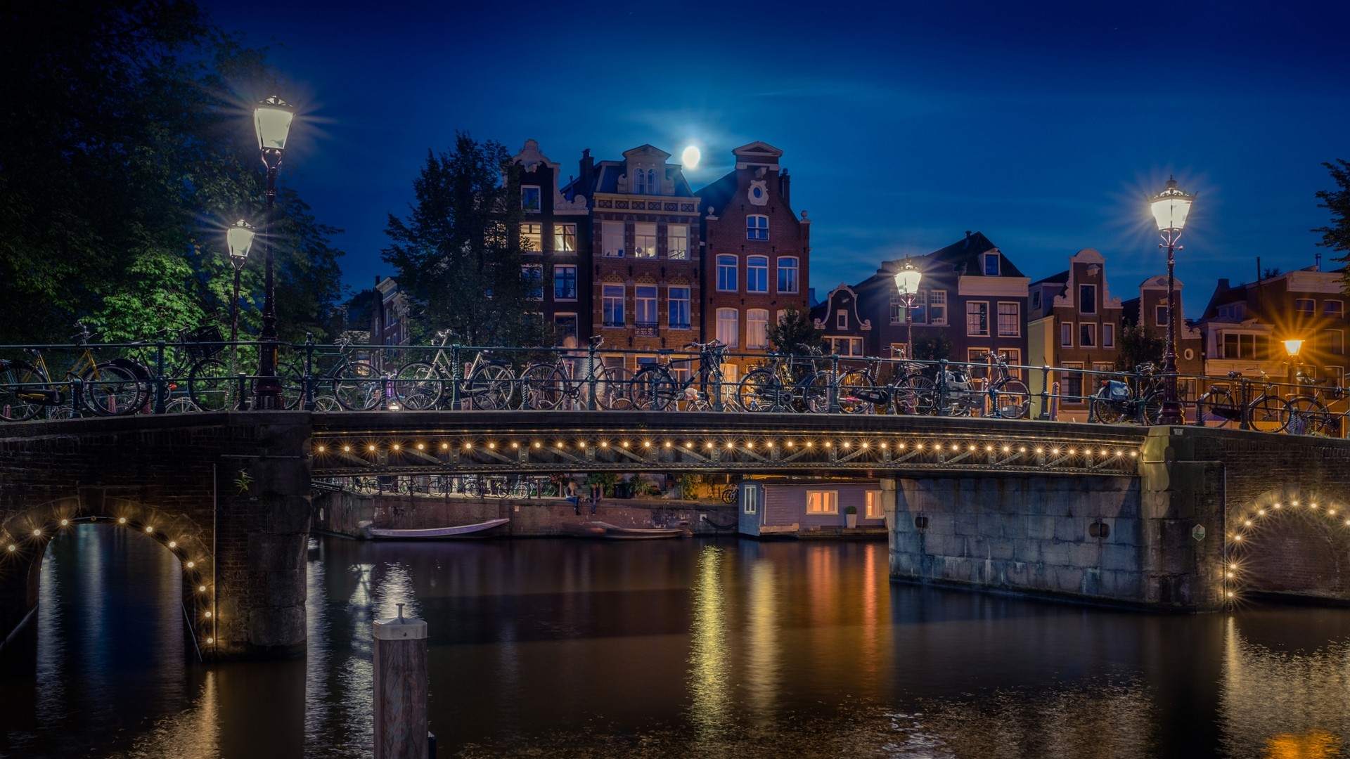 General 1920x1080 landscape Amsterdam bridge lights lantern canal Moon trees building house urban bicycle evening water Netherlands