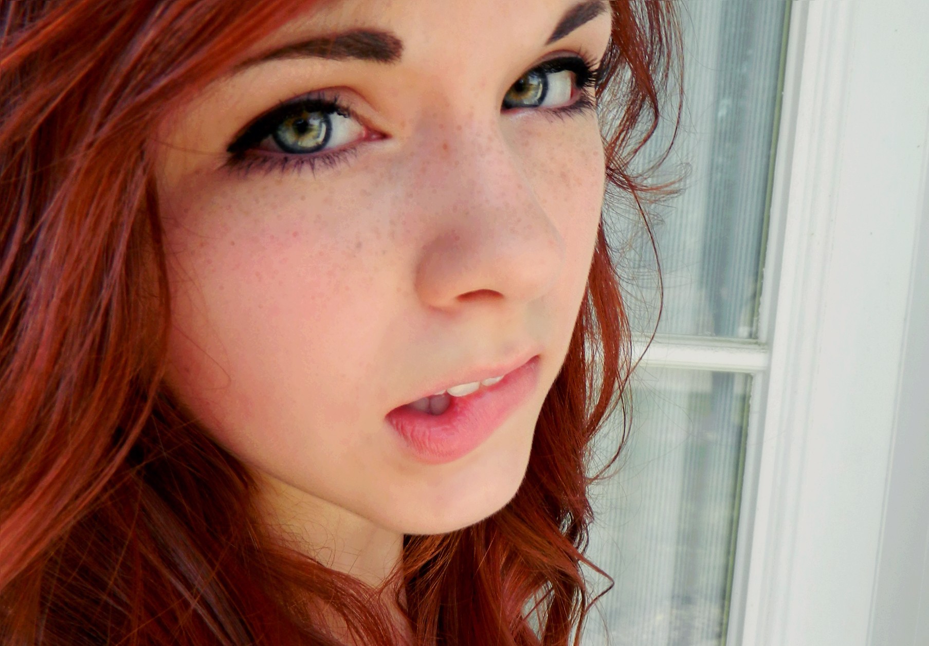 People 1807x1257 redhead women green eyes face freckles biting lips closeup looking at viewer Claire Monnier