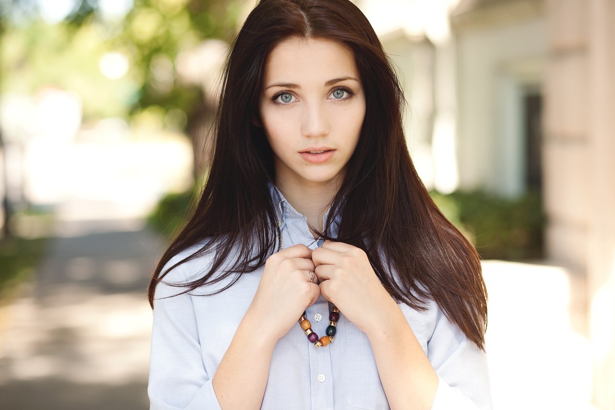 People 1200x800 Emily Rudd brunette blue eyes hands on chest necklace looking at viewer women women outdoors urban long hair