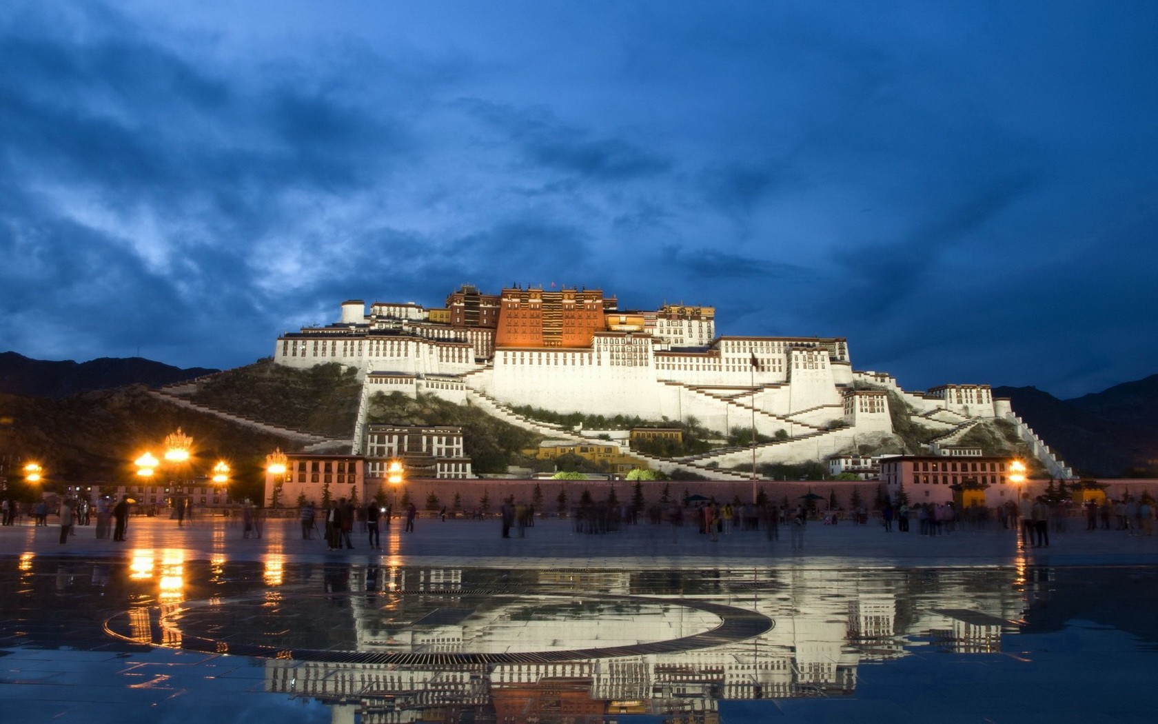 General 1680x1050 Buddhism architecture Tibet Potala Palace palace evening hills stairs clouds lights rocks town square reflection water Tourism mountains Lhasa