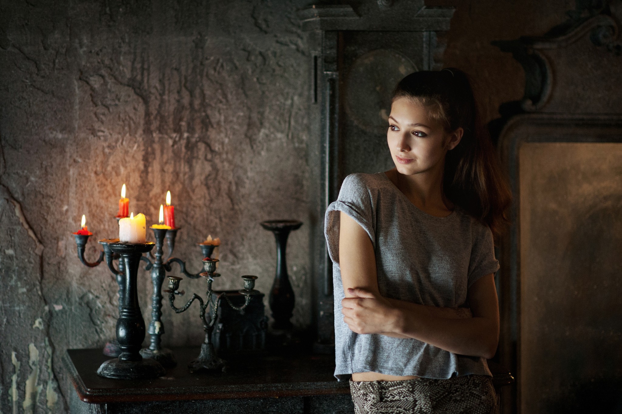 People 2048x1363 Catherine Shmeleva women brunette model long hair looking away T-shirt candles interior Maxim Maximov women indoors standing arms crossed low light