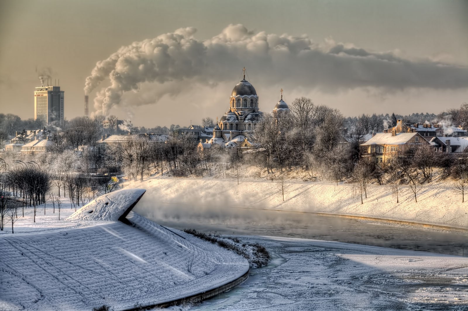 General 1600x1064 architecture city cityscape trees building Lithuania landscape winter snow cathedral smoke chimneys frost frozen river cold