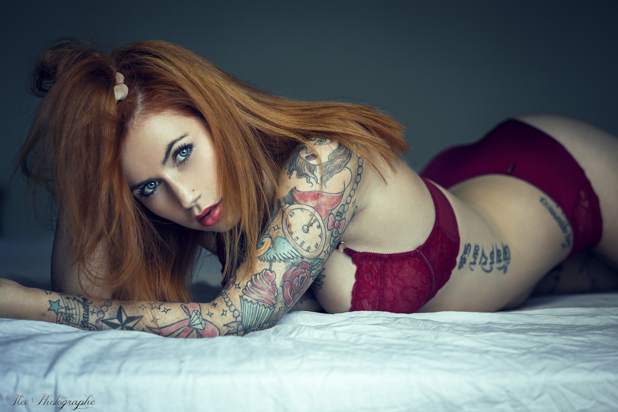 People 2048x1365 women model long hair lying on front ass arched back lingerie panties redhead tattoo looking at viewer blue eyes in bed hands in hair pierced nose red lipstick inked girls women indoors bra watermarked Alexis Palliot