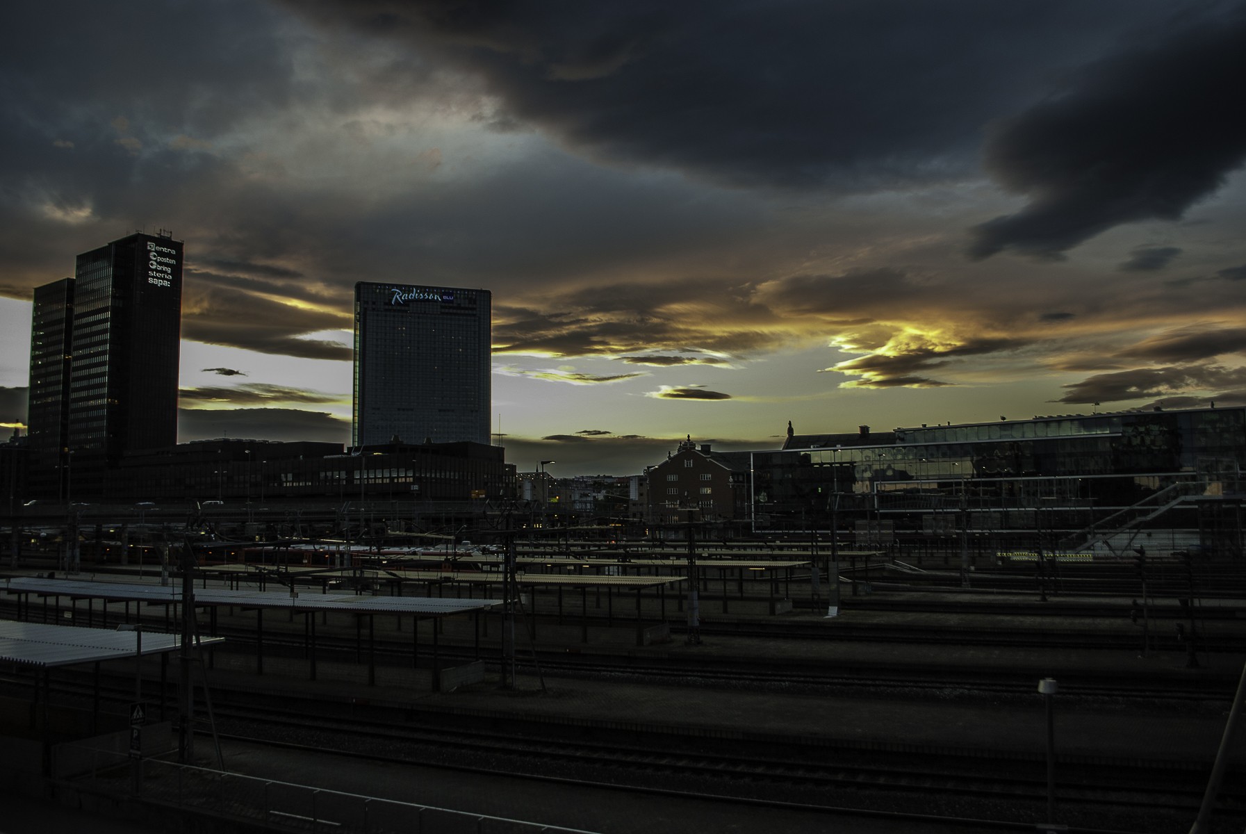 General 1793x1200 cityscape evening railway Oslo train station dark sky clouds Norway low light