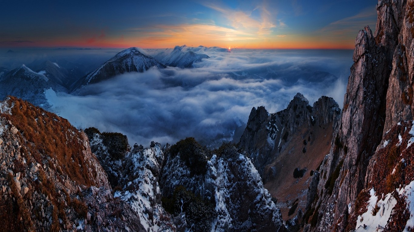General 1366x768 nature landscape sunset mountains clouds snowy peak summit cliff horizon