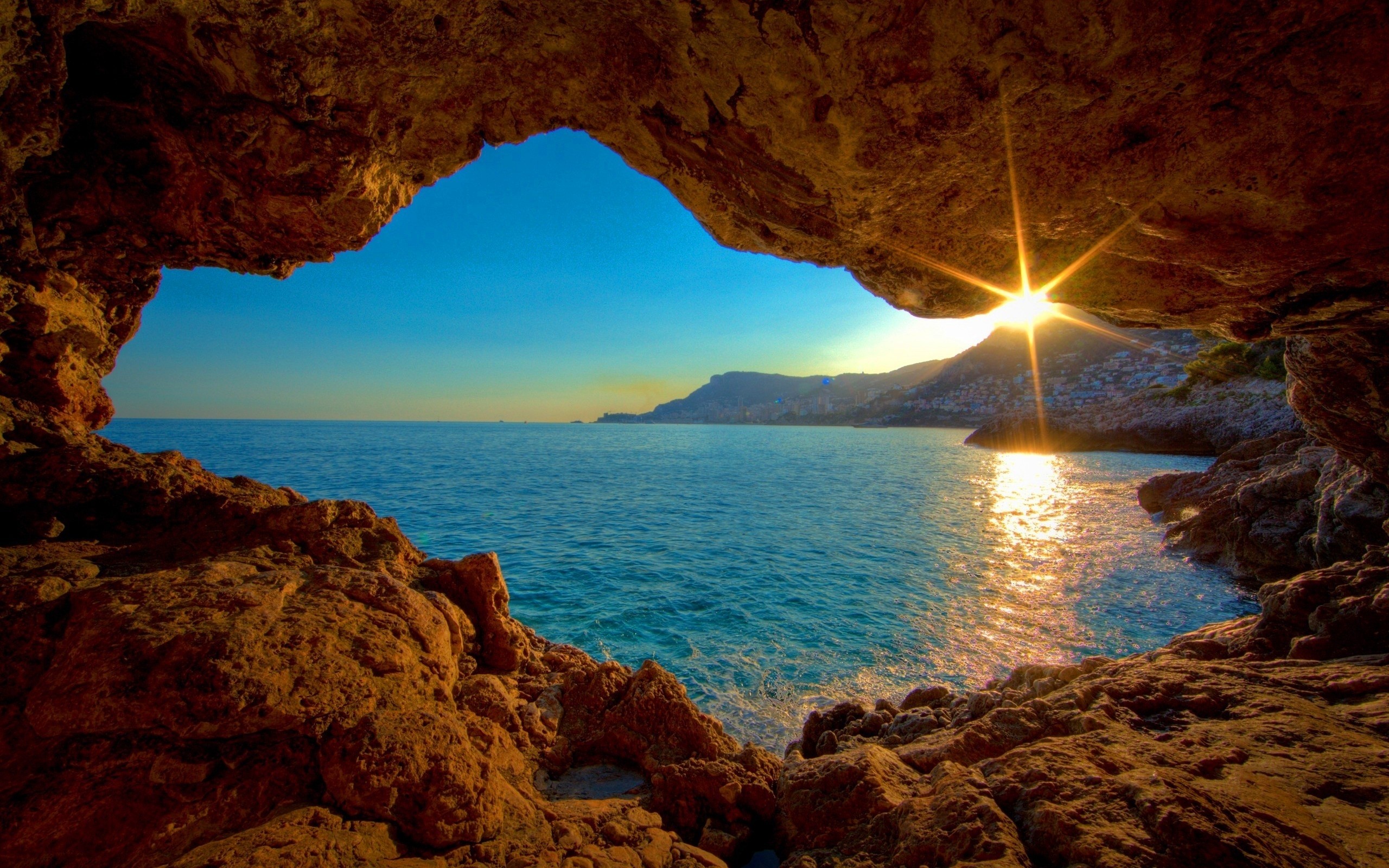 General 2560x1600 nature sea cave sun rays sunlight mountains