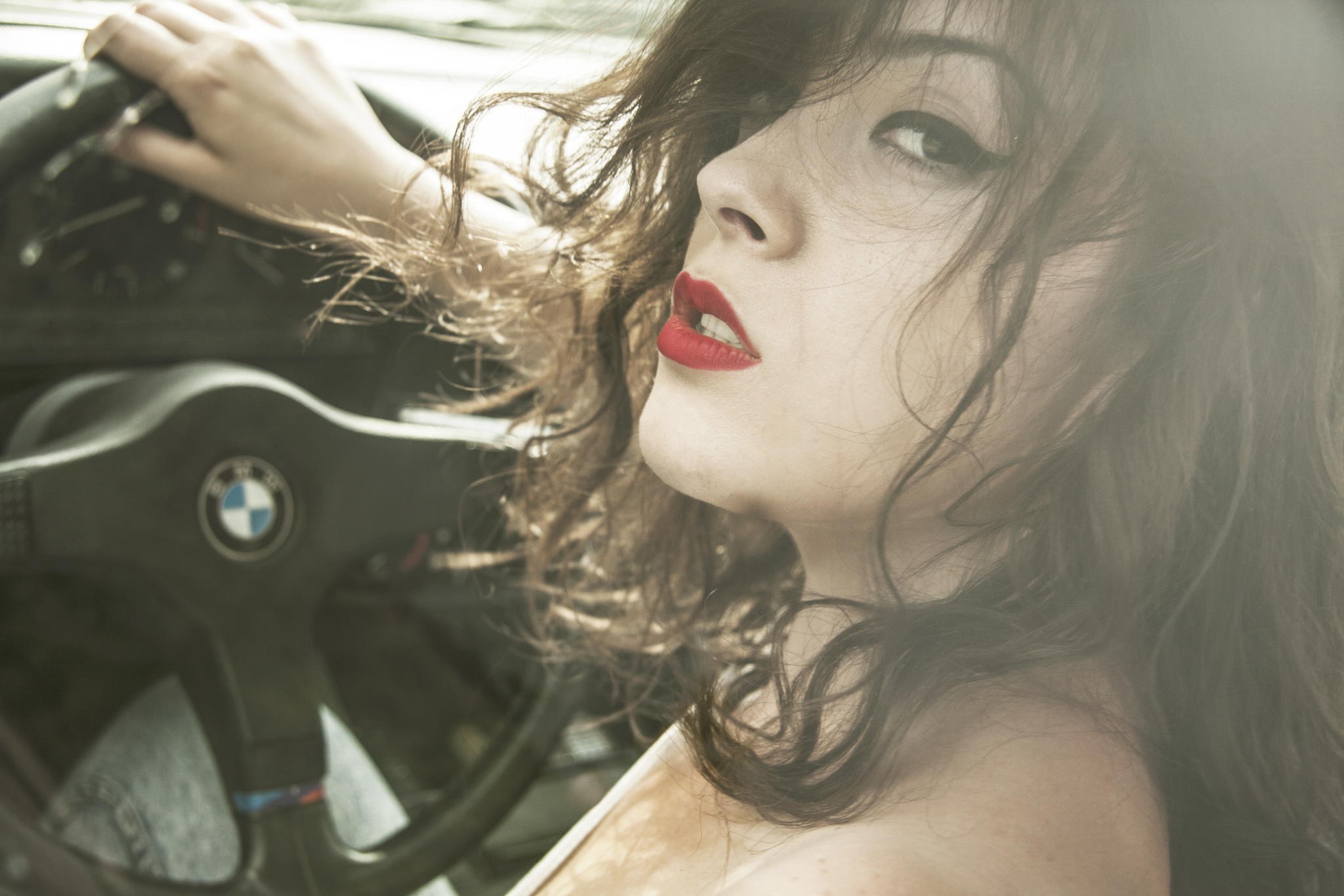 People 2048x1365 car women brunette BMW women with cars steering wheel car interior looking at viewer face model lipstick makeup red lipstick hair in face