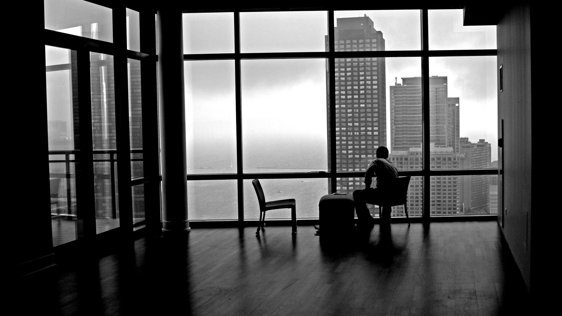 General 1920x1080 urban city room indoors monochrome men men indoors looking out window chair sitting