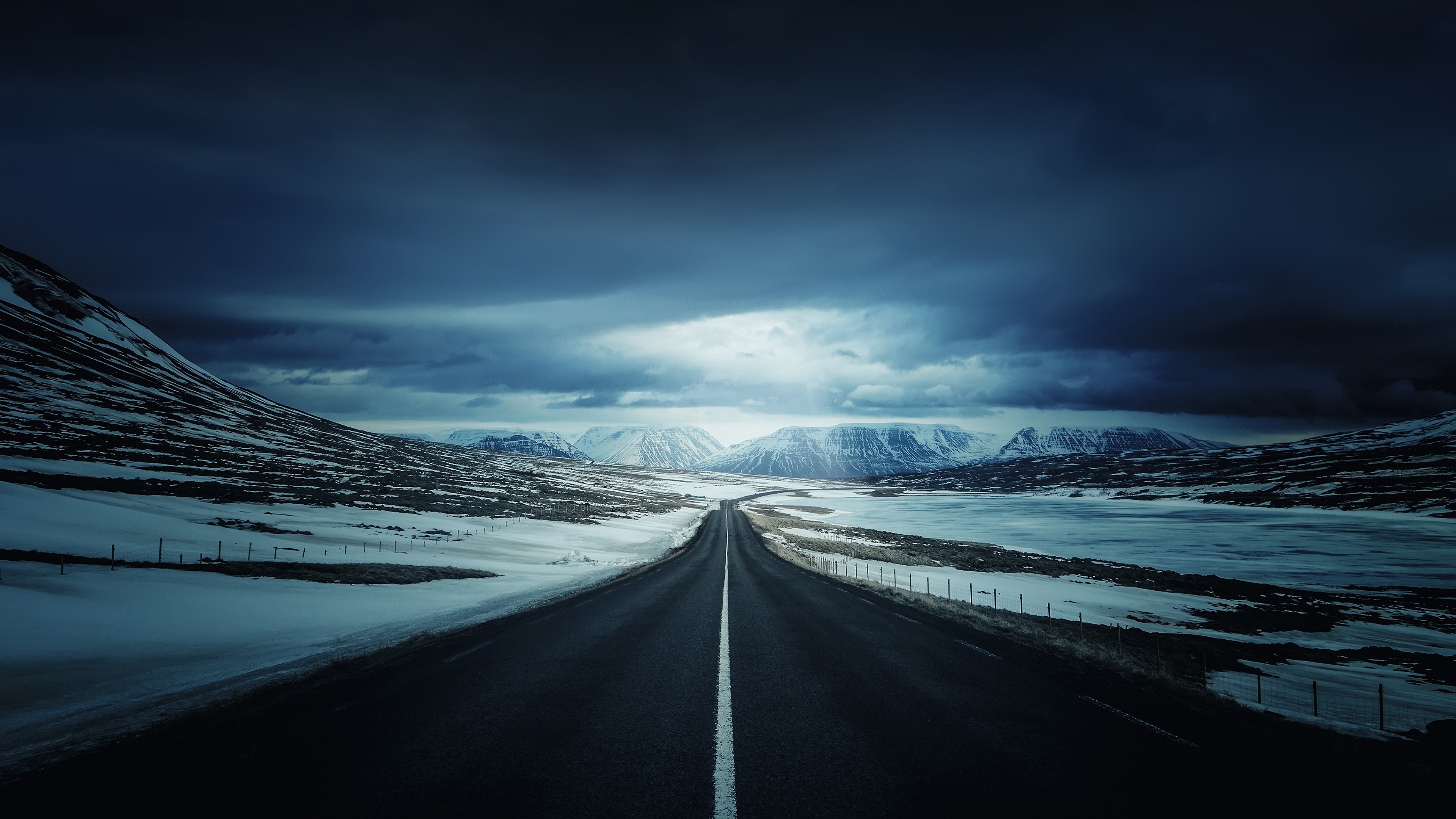 General 3840x2160 road snow mountains landscape Iceland blue plains fence snowy mountain overcast long road nordic landscapes