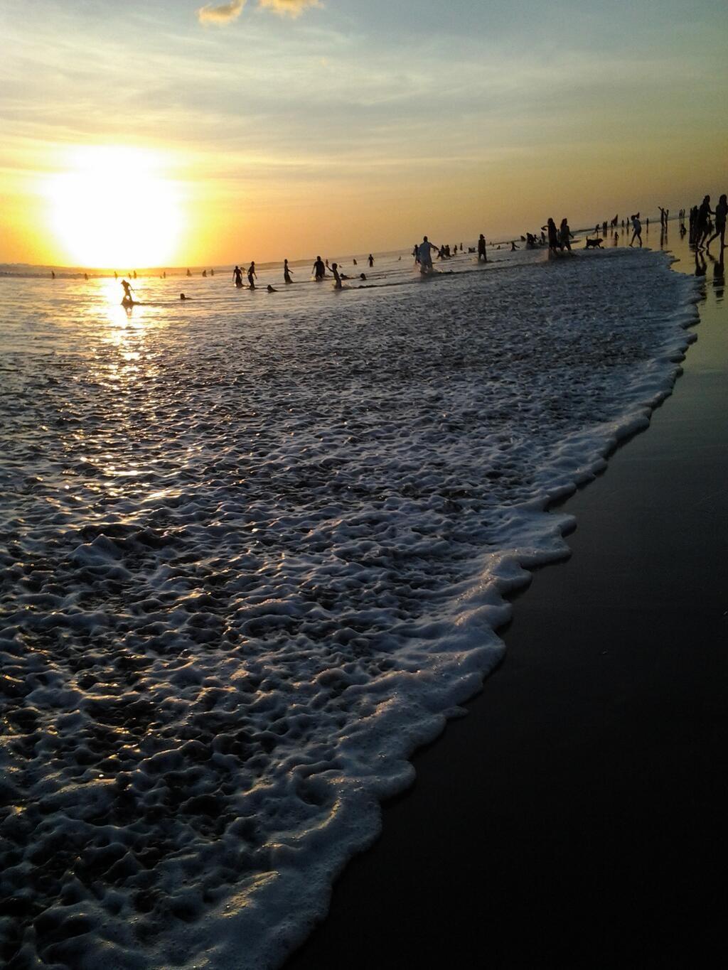 General 1024x1365 beach sunset Bali waves people sky sand