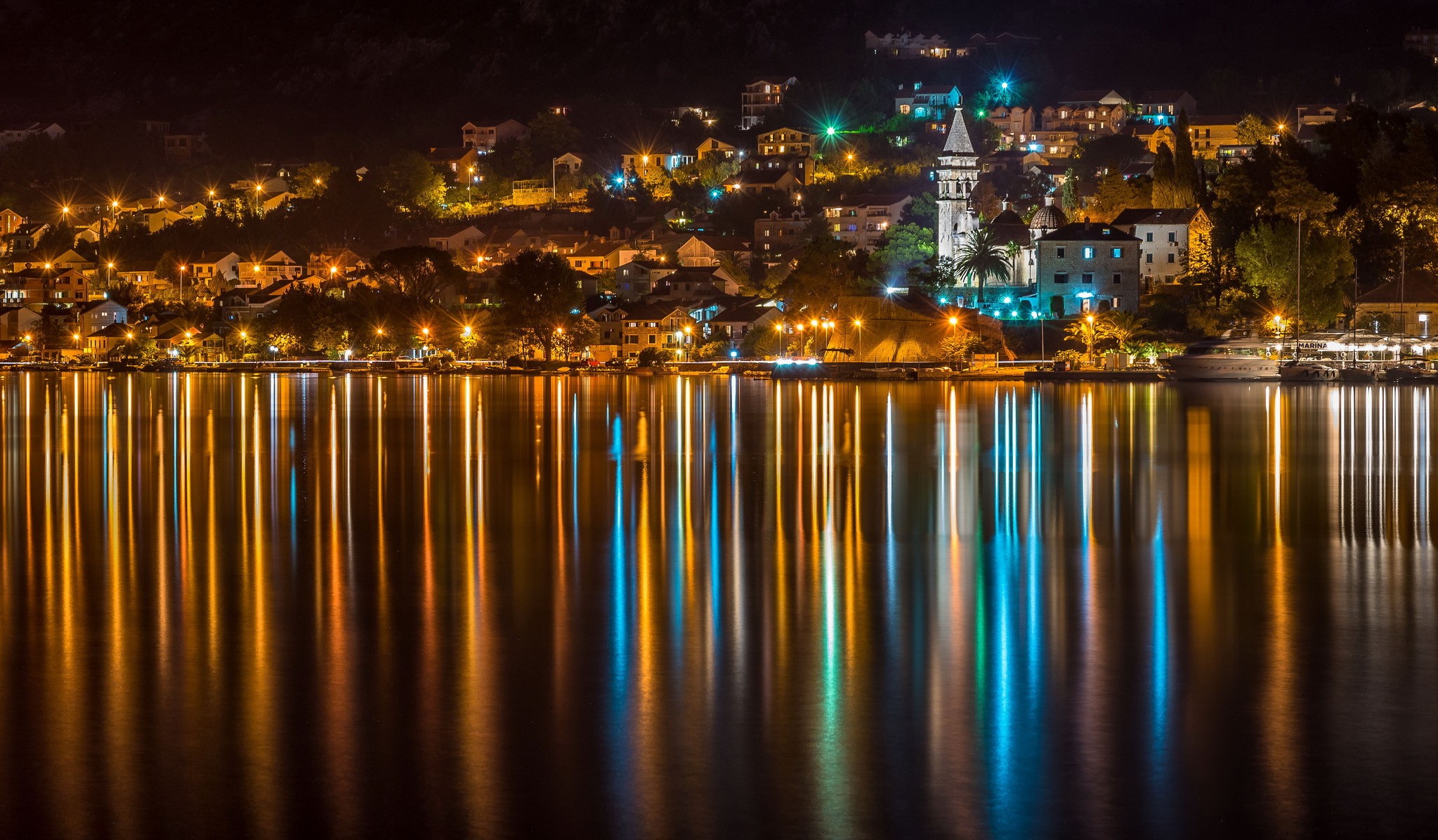 General 2047x1196 cityscape night lights building reflection water church trees Montenegro town yacht