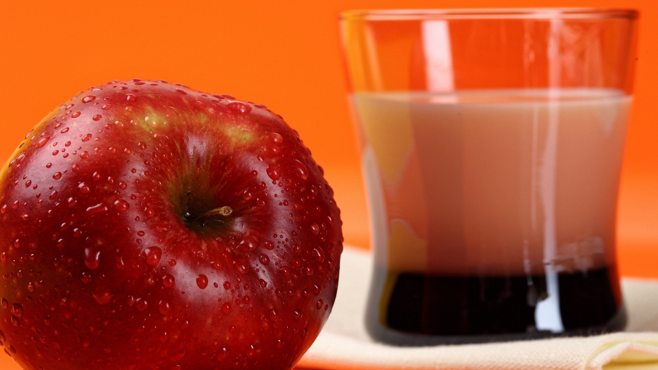 General 2500x1407 apples fruit food water drops orange background drinking glass closeup