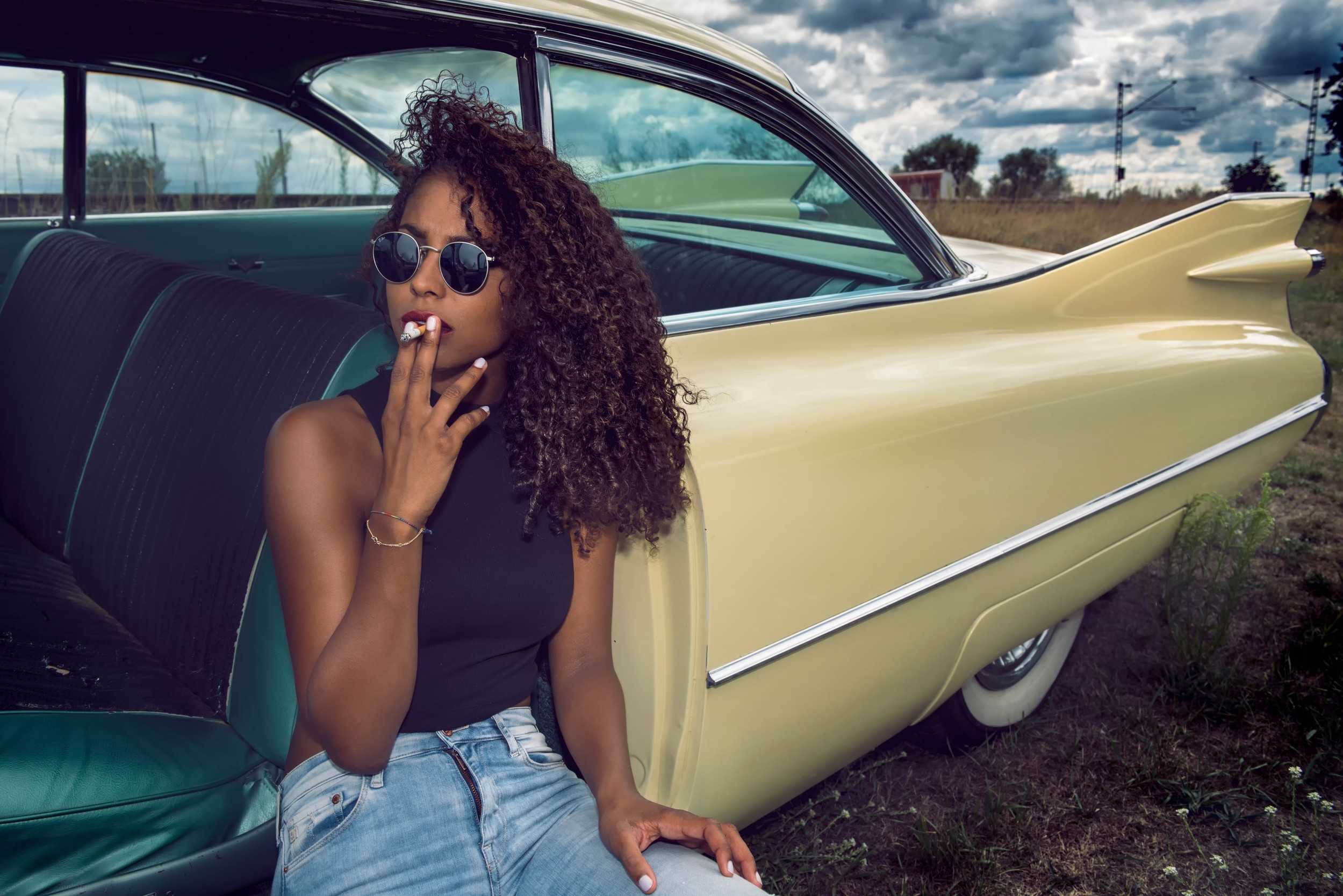 People 2499x1668 smoking women model vehicle car dark skin jeans women with shades women with cars cigarettes curly hair oldtimers sitting sunglasses red lipstick women outdoors outdoors