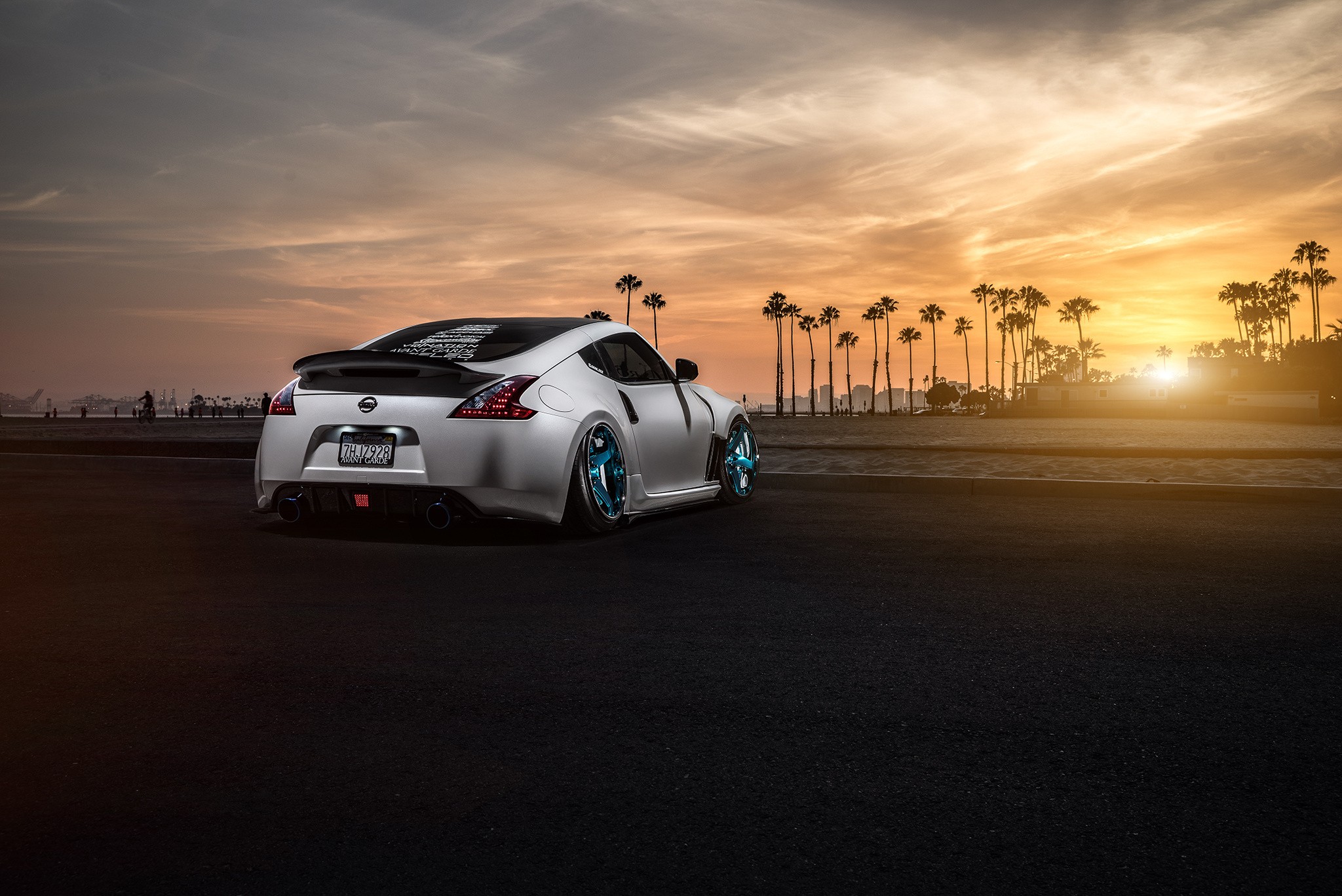 General 2048x1367 Nissan car stance (cars) sunlight palm trees colored wheels Nissan Fairlady Z Nissan 370Z silver cars vehicle sky Japanese cars