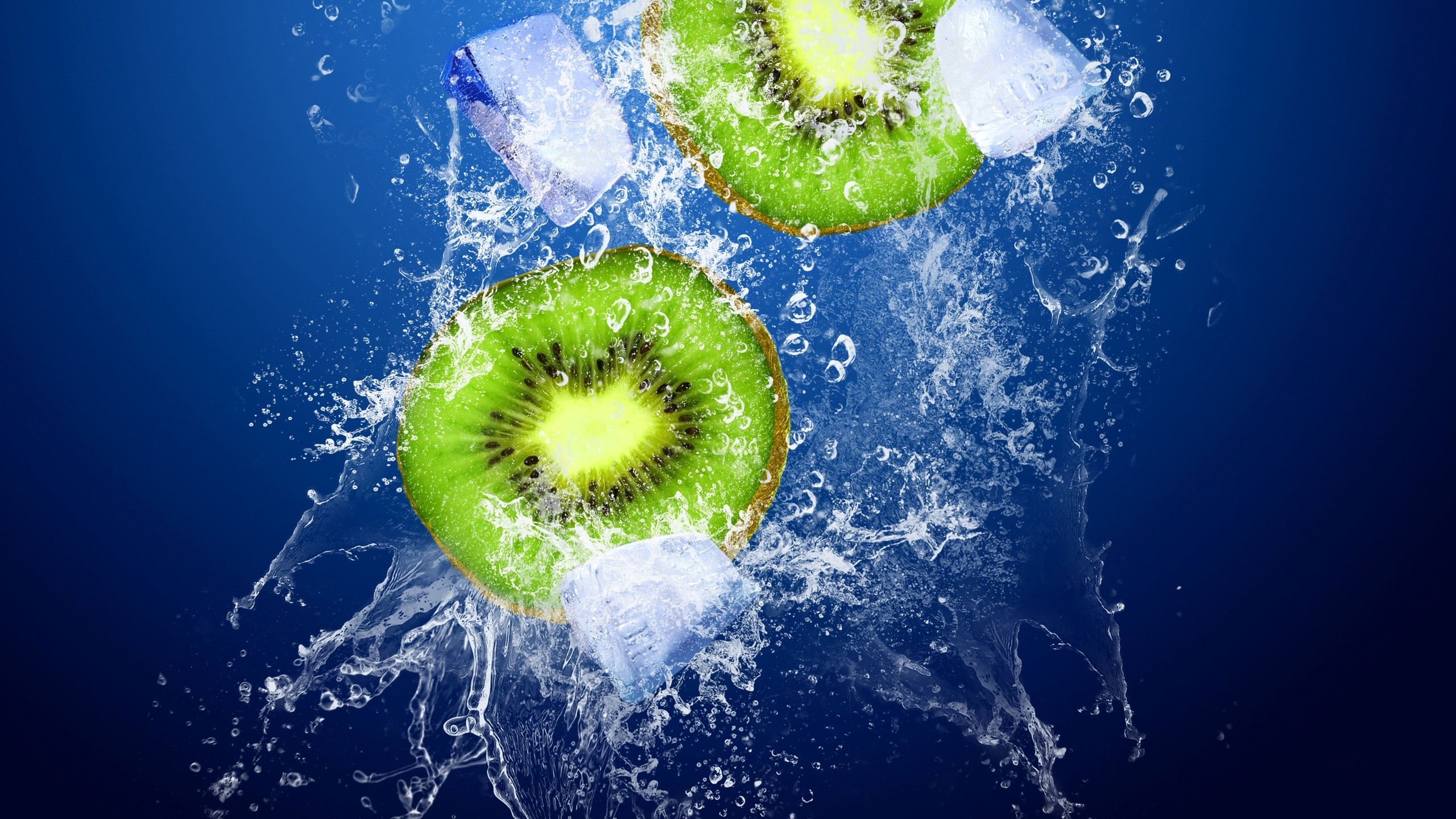 General 2560x1440 water splashes kiwi (fruit) ice food fruit simple background blue background