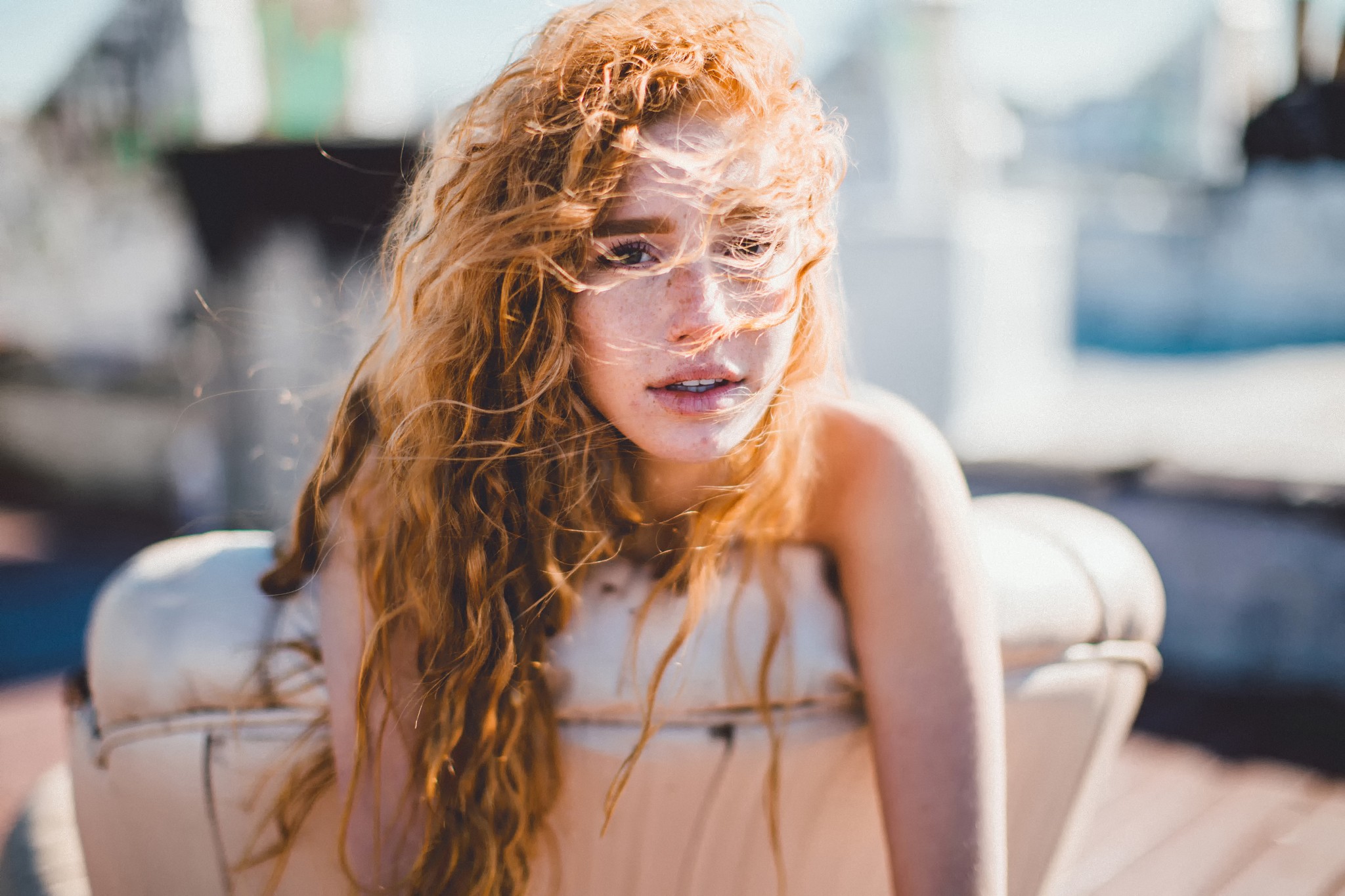 People 2048x1365 women model redhead long hair bare shoulders freckles wavy hair curly hair open mouth looking away couch windy hair in face depth of field face chair
