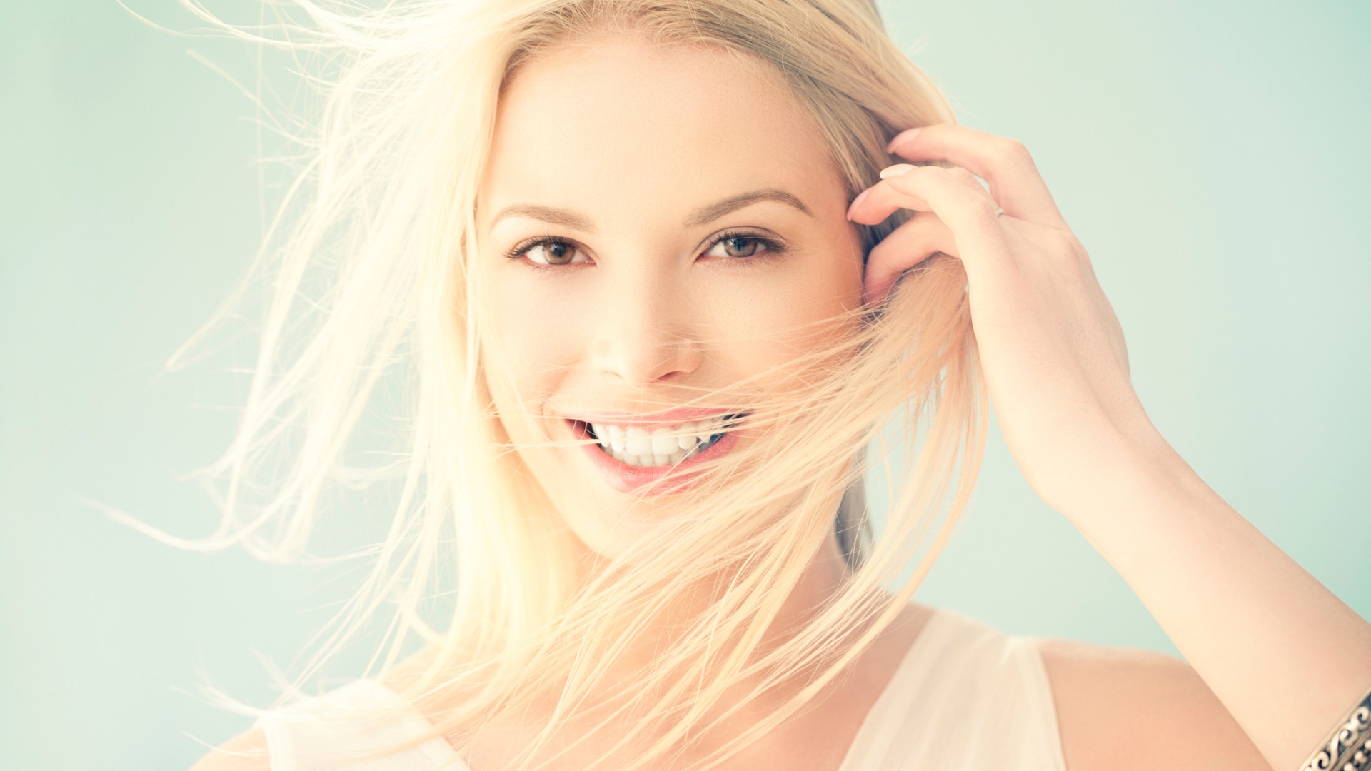 People 1920x1080 blonde smiling face women simple background closeup model looking at viewer hair in face