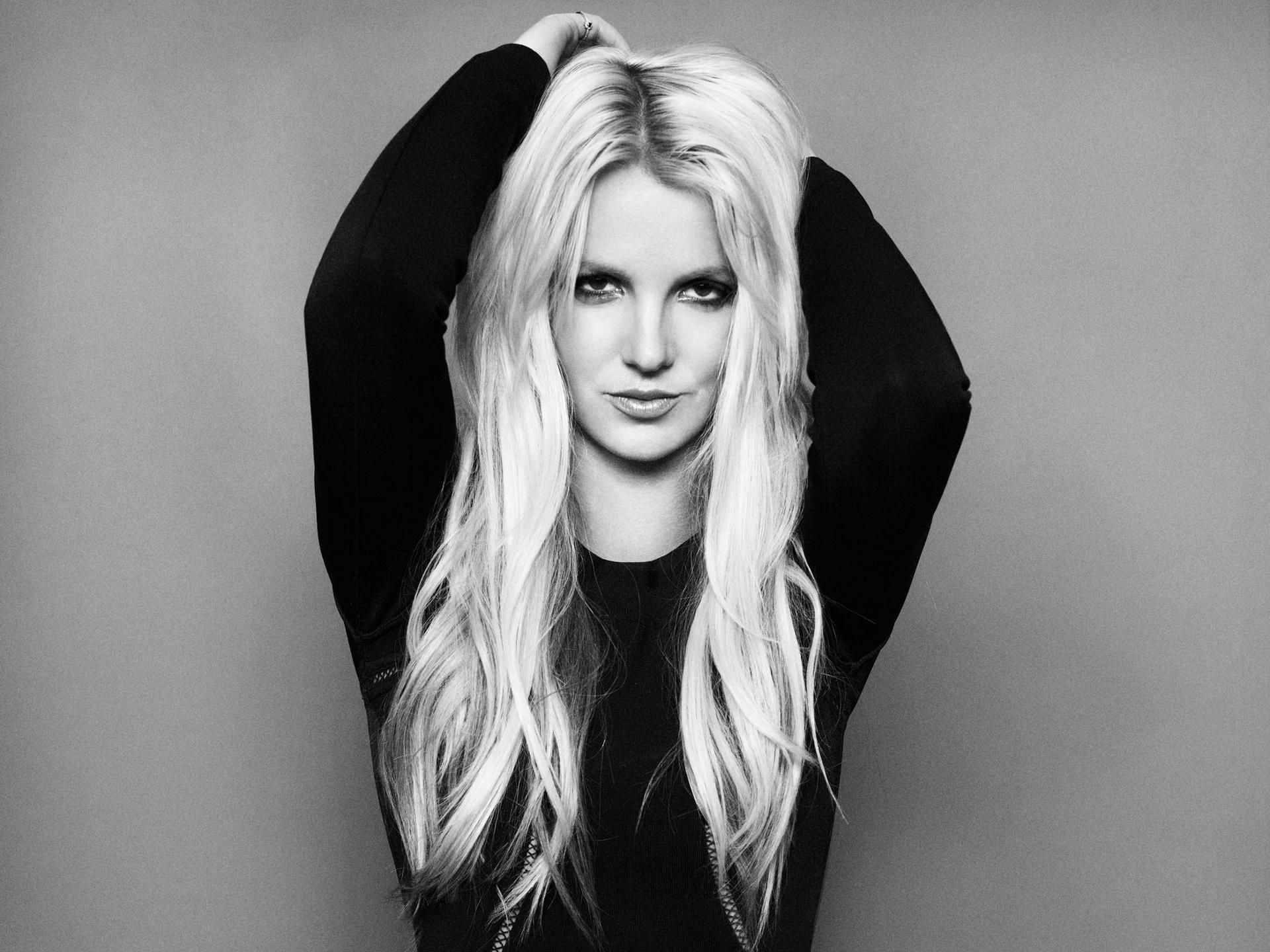 People 1920x1440 monochrome women singer celebrity blonde Britney Spears women indoors studio looking at viewer arms up simple background long hair