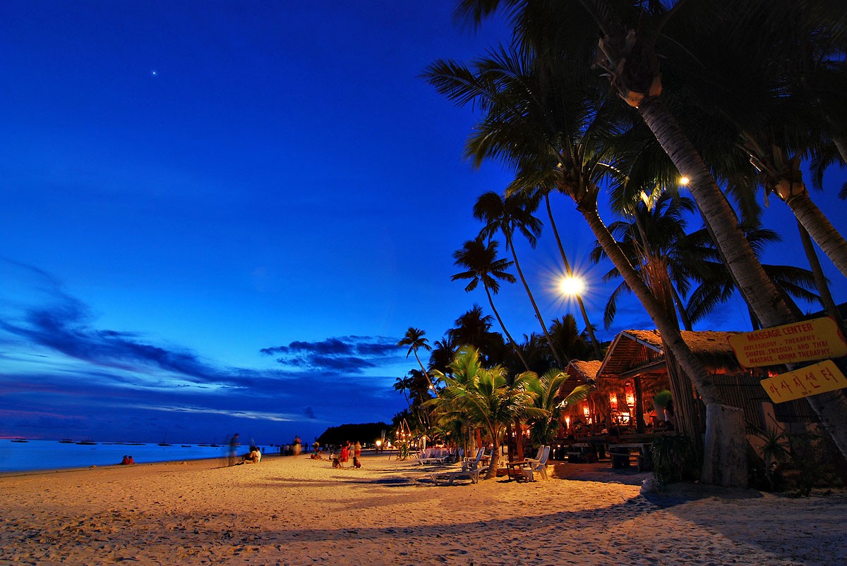 General 1200x803 beach dusk Philippines palm trees night