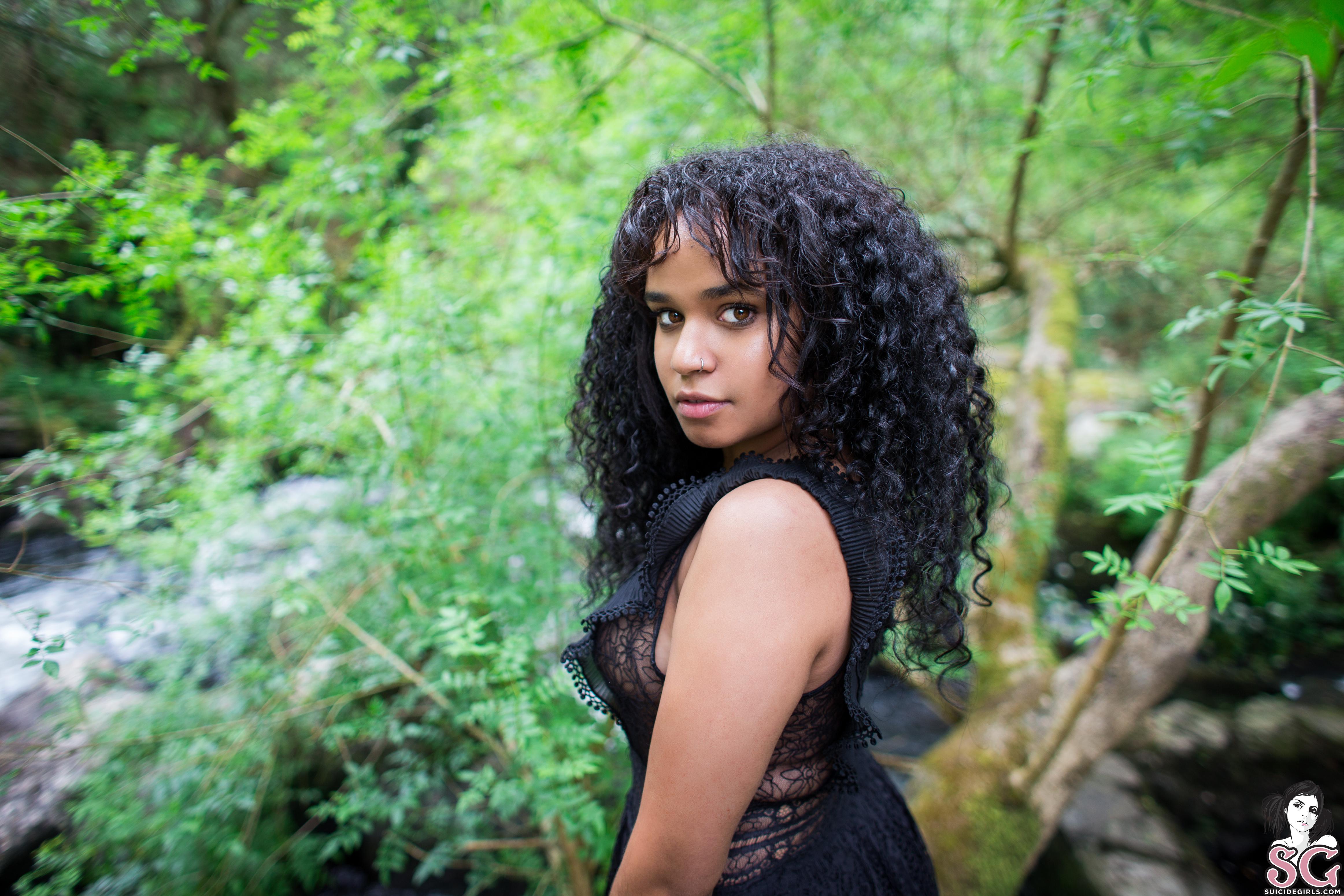 People 4650x3100 Synesthesia women brunette nature forest curly hair looking over shoulder see-through dress plants log water brown eyes Suicide Girls long hair