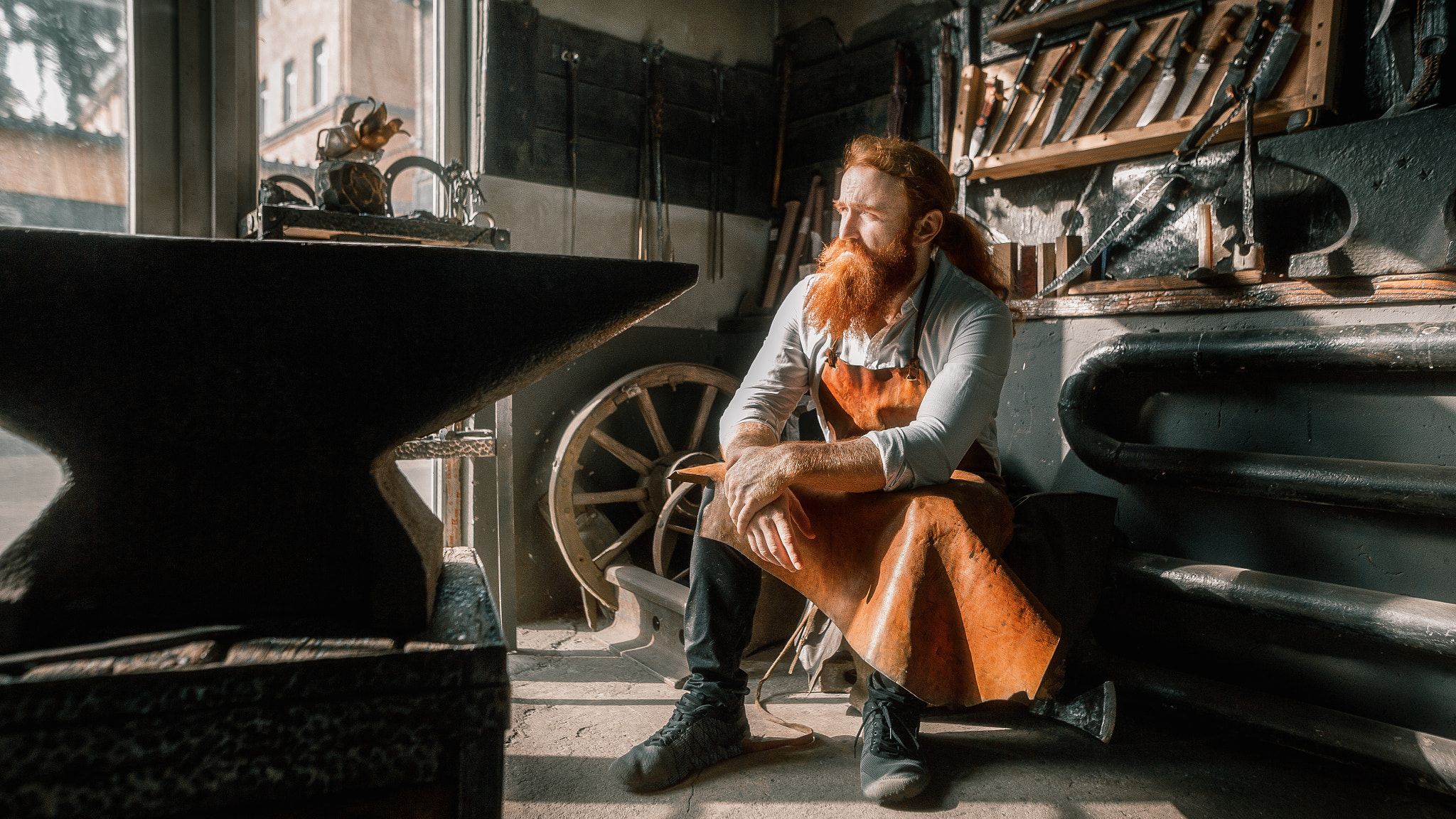 People 2048x1152 Andrew Vasiliev men redhead beard looking away apron weapon sword blacksmith workshop