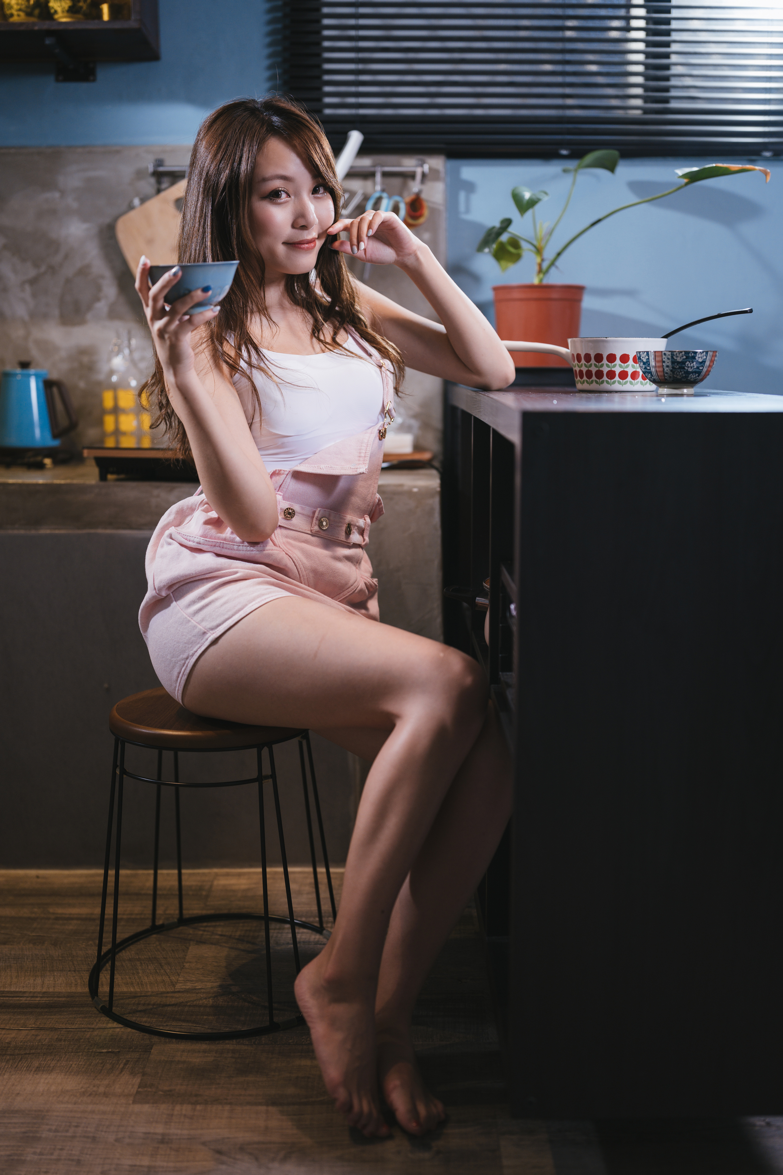 People 2560x3840 Asian model women long hair dark hair depth of field chair sitting table cup flowerpot plants kitchen pink shorts white tops barefoot portrait display