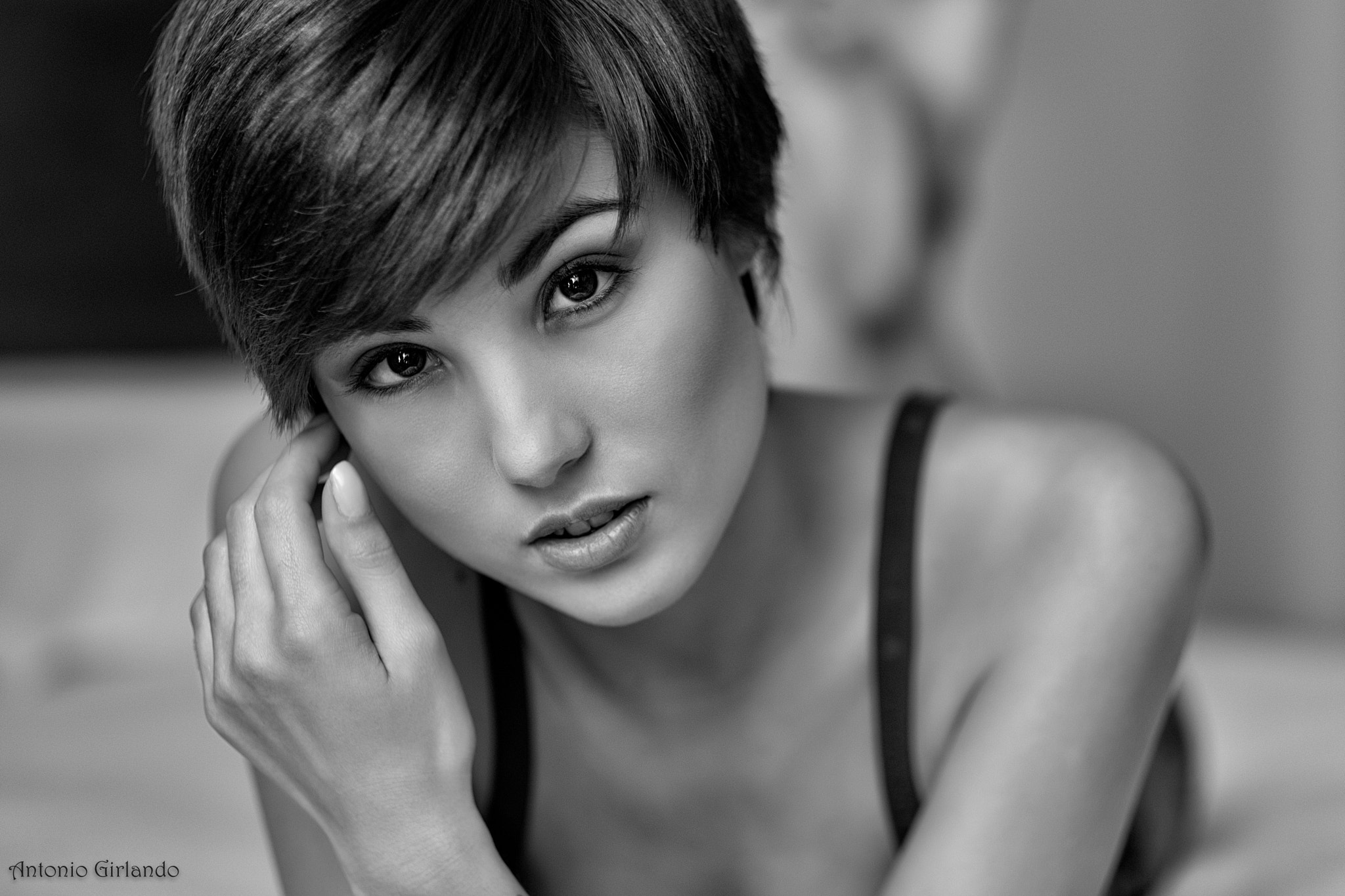 People 2048x1365 Giorgia Soleri Antonio Girlando model women short hair brunette face black bras hand on face brown eyes bare shoulders in bed looking at viewer lying on front watermarked monochrome closeup