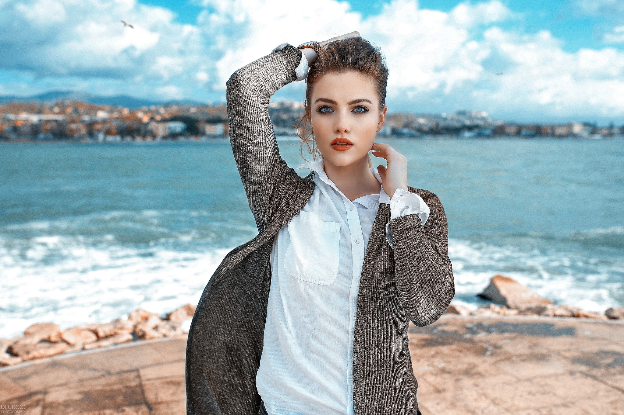 People 2048x1365 women brunette blue eyes sea waves women outdoors portrait open sweater white shirt juicy lips coast face windy Alessandro Di Cicco April Slough arms up