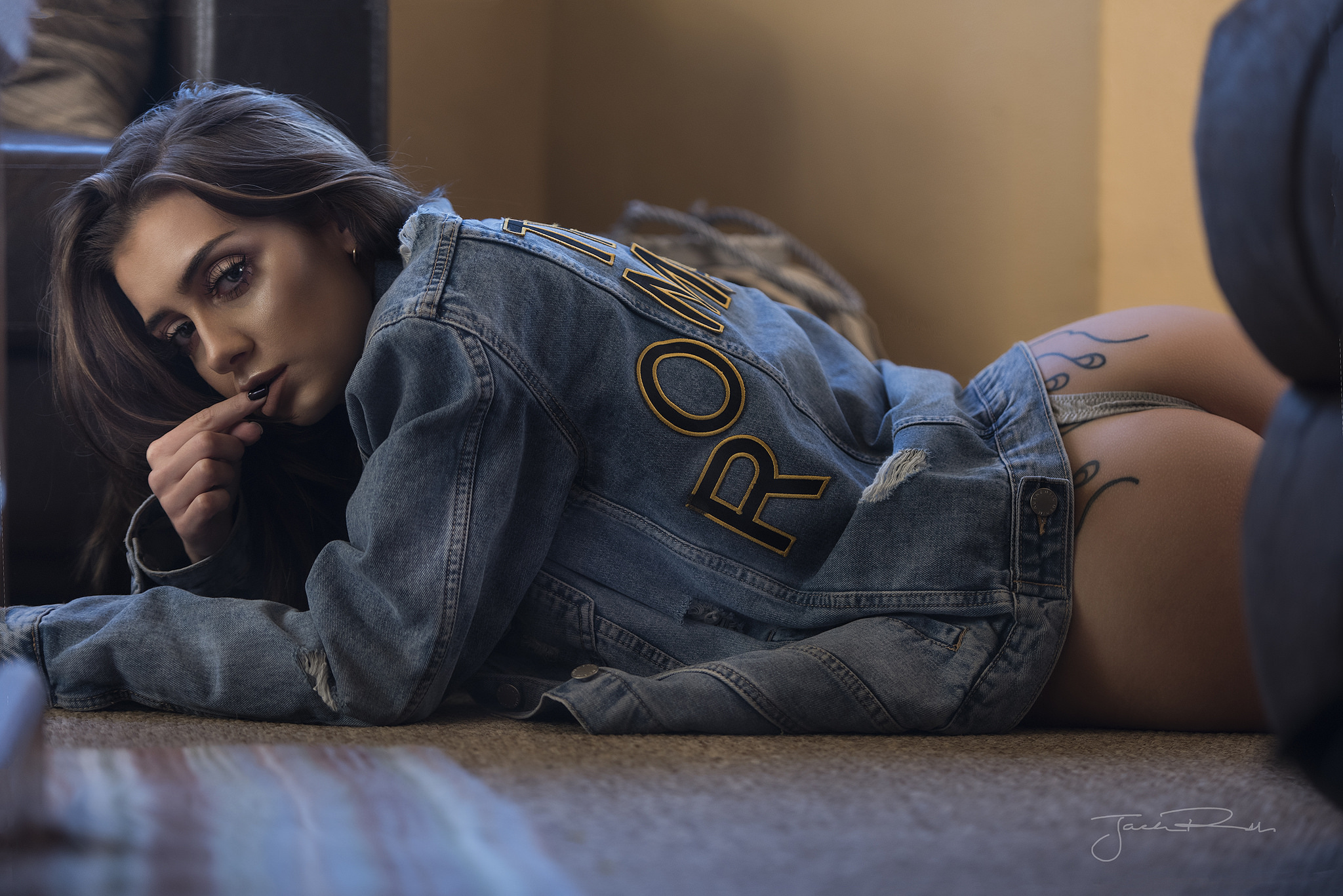 People 2048x1367 women Jack Russell ass finger on lips tanned panties black nails lying on front denim tattoo denim jacket