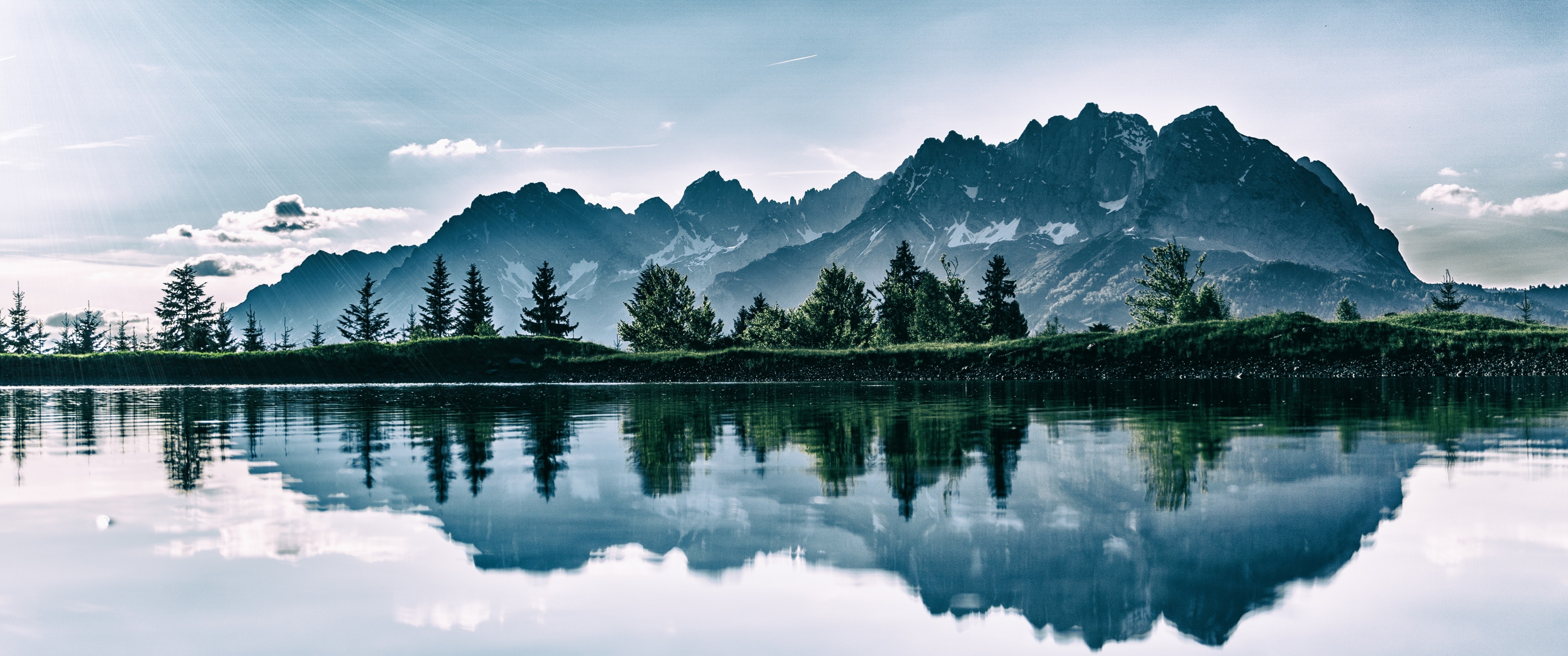 General 3440x1440 mountains pine trees lake nature clouds sun rays grass water reflection trees