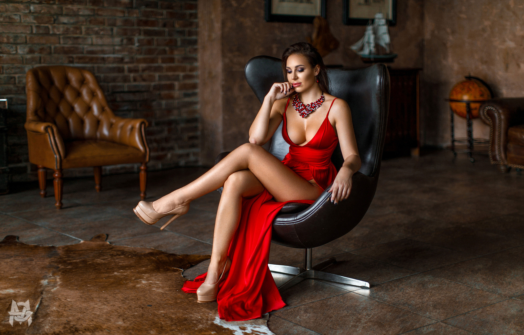 People 2048x1309 women Mihail Gerasimov sitting high heels red dress legs brunette painted nails legs crossed cleavage classy glamour touching face leather chair makeup