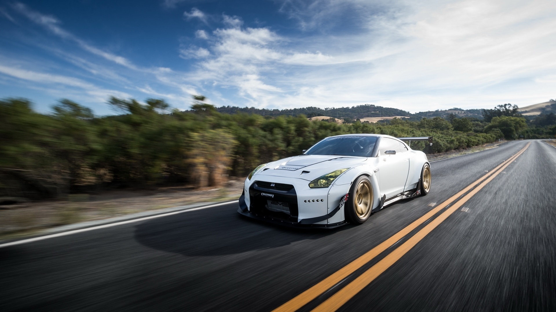 General 1920x1080 Nissan GT-R road white cars supercars asphalt nature daylight sunlight trees plants sky clouds Nissan Japanese cars bodykit